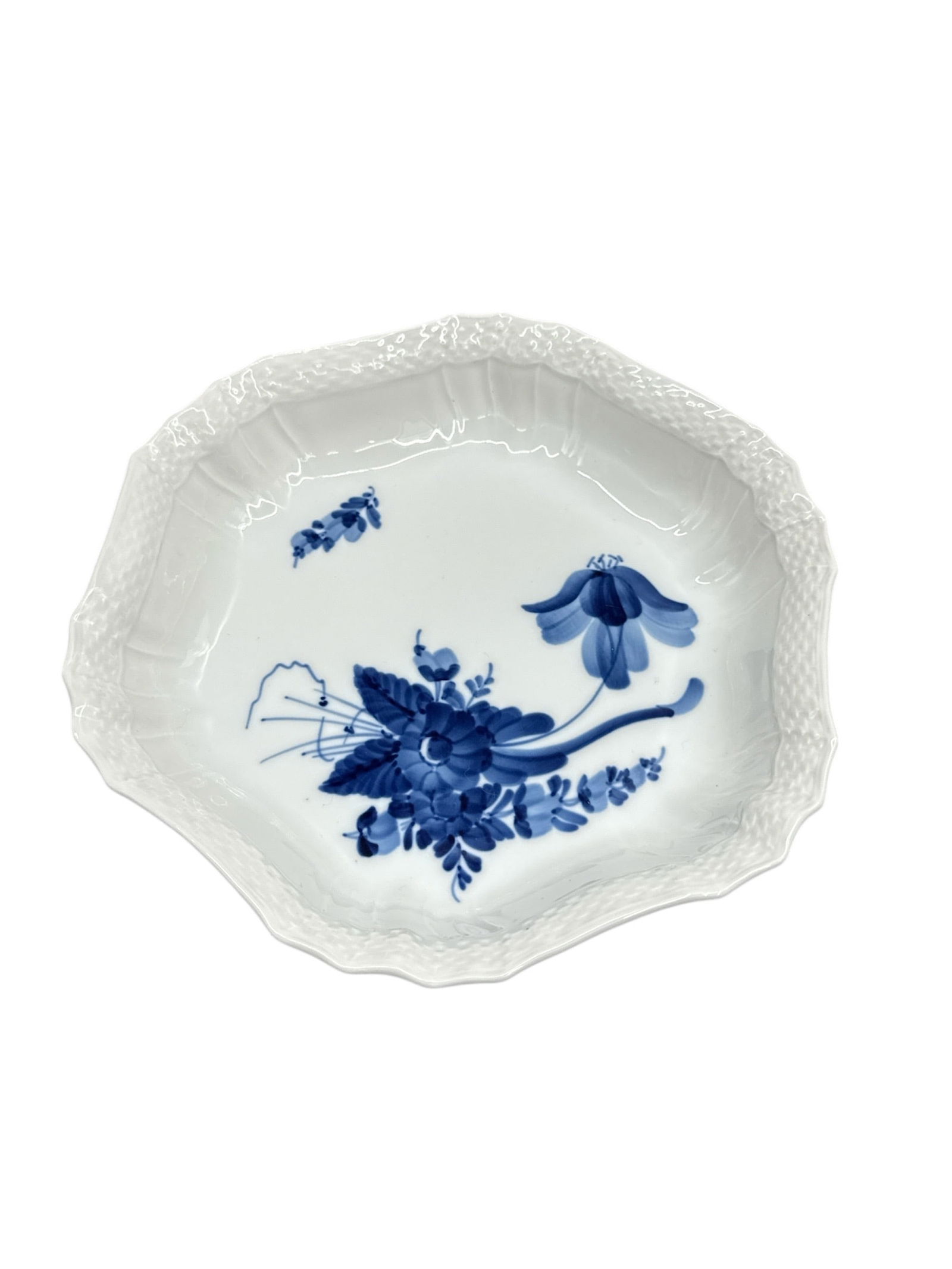 Royal Copenhagen Blue Flowers Porcelain Plate: Fine porcelain plate by Royal Copenhagen from the Blue Flowers pattern, featuring hand-painted blue floral decoration on a white ground. The design showcases delicate botanical motifs rendered in