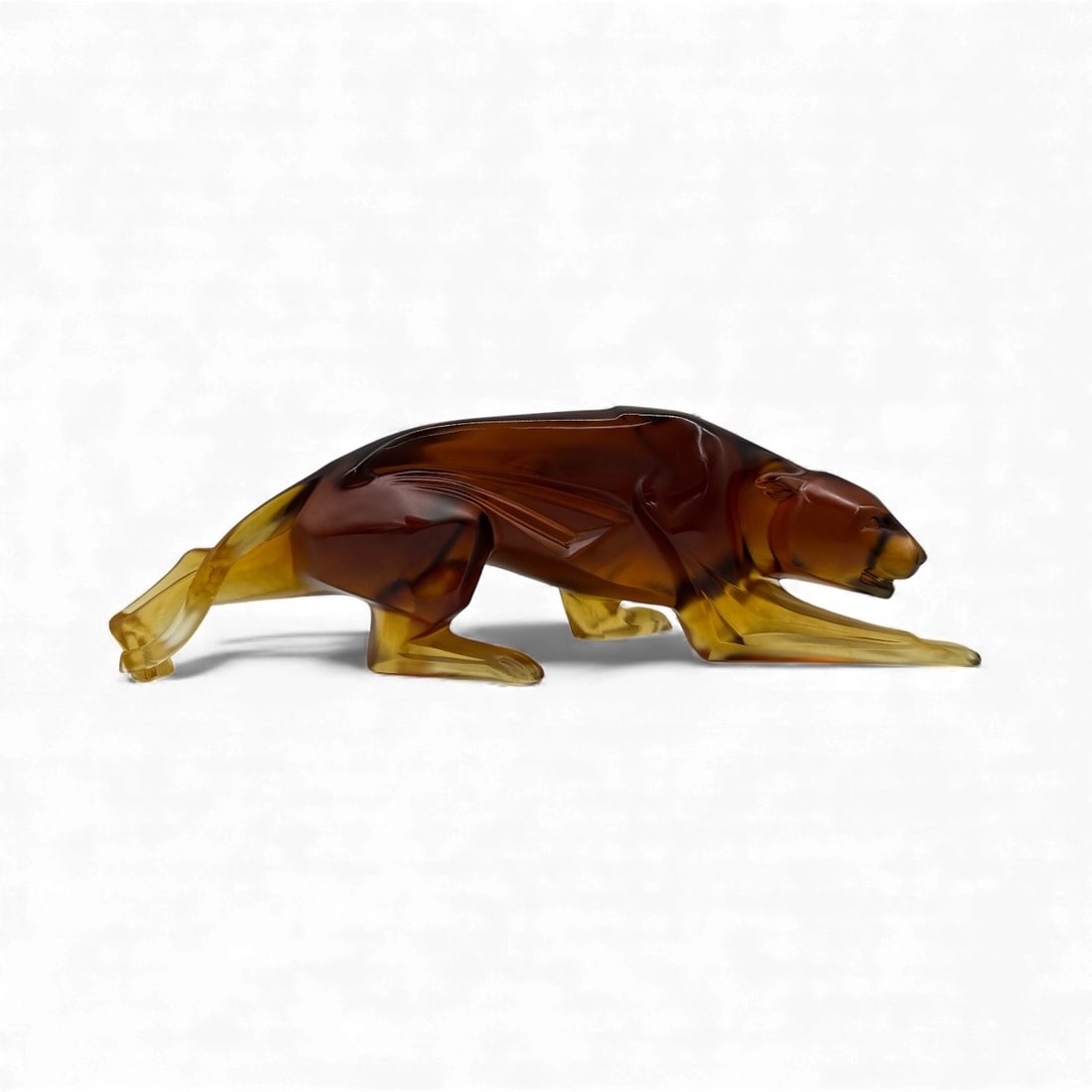 Weinman Amber Glass Panther Sculpture, Pate De Verre: Amber glass panther sculpture by Weinman, numbered 3/500. Pate De Verre. Dimensions: H:5 inches, L:17 inches, W:4 inches.