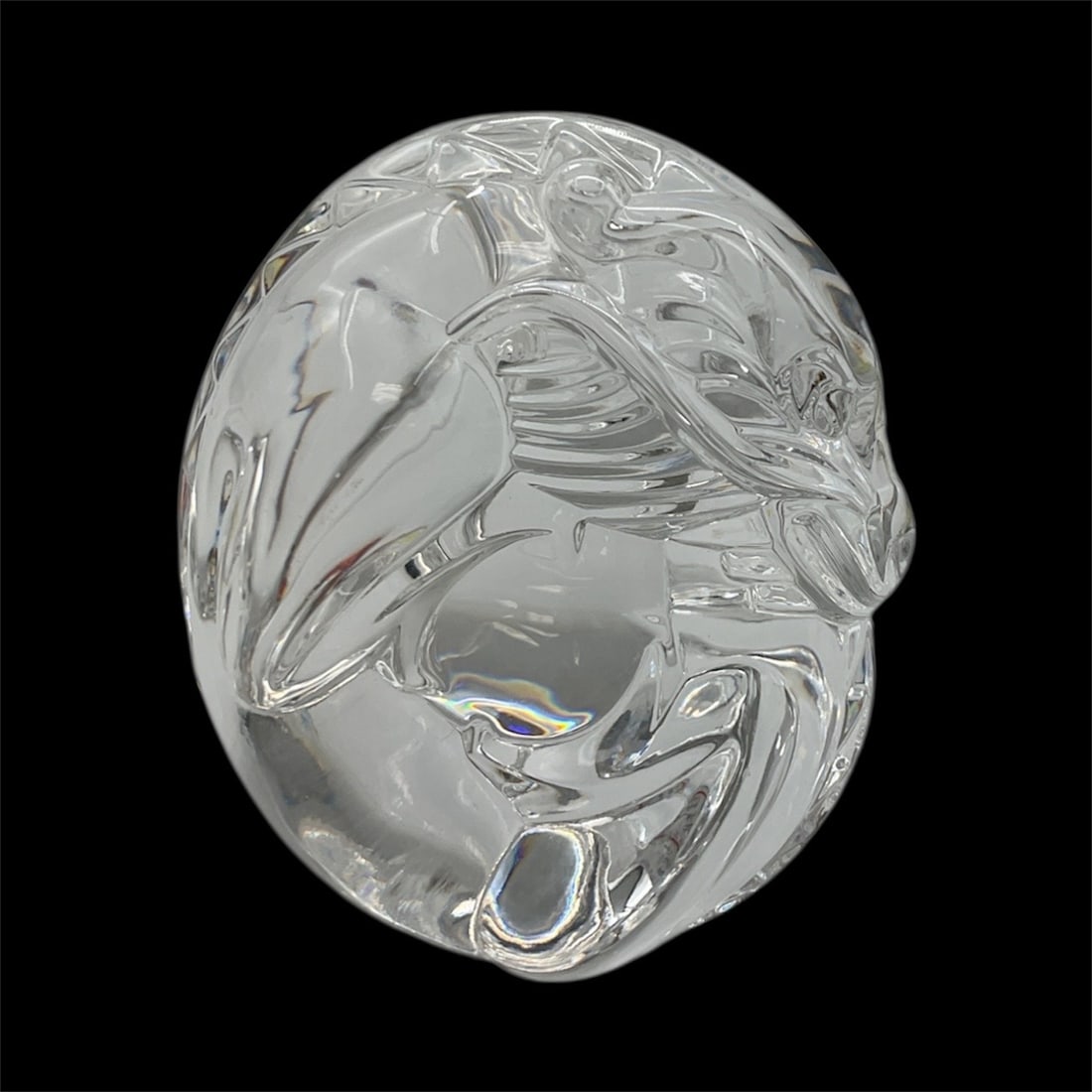 Steuben Crystal Dragon Paperweight /: Intricately sculpted Steuben crystal paperweight depicting a stylized dragon in fluid, swirling form. Exceptional clarity and craftsmanship highlight the creature’s dynamic contours, making it a