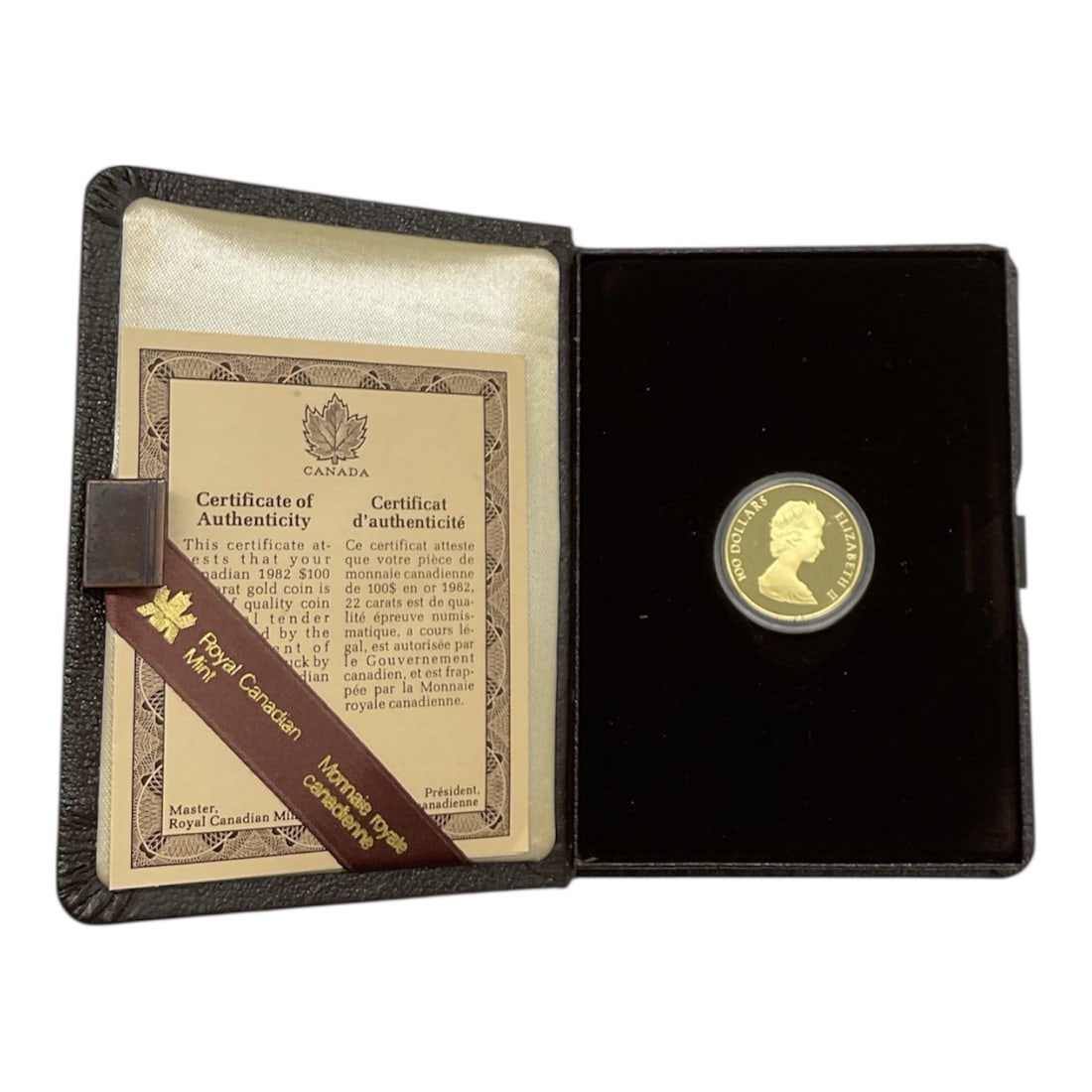 1982 Canadian Olympic Constitution 22 Karat Gold Proof Coin in Presentation Case: This official Canadian Olympic gold proof coin was minted by the Royal Canadian Mint in 1982 to commemorate the Olympic Constitution. Struck in 22 karat gold, the coin weighs 16.965 grams and
