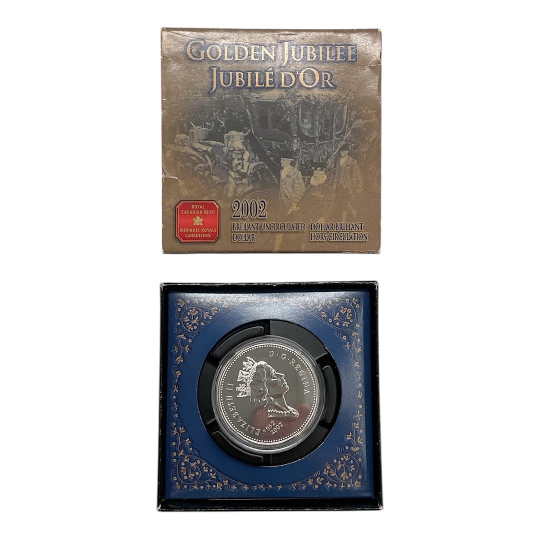 2002 Canadian Golden Jubilee Brilliant Uncirculated Dollar Coin in Presentation Case: This commemorative Canadian dollar coin was issued by the Royal Canadian Mint in 2002 to mark the Golden Jubilee of Queen Elizabeth II, celebrating fifty years of her reign from 1952 to 2002. Struck
