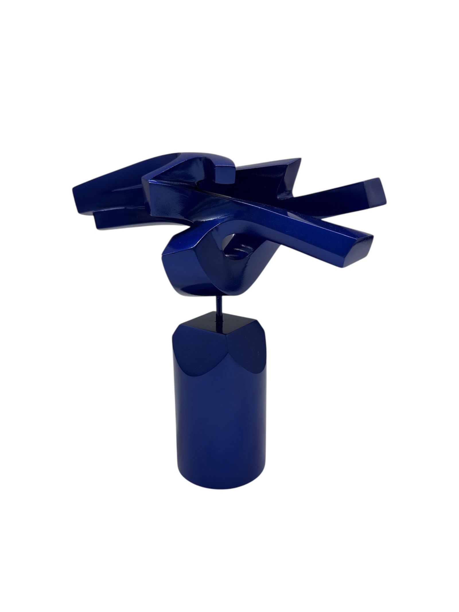 Contemporary Blue Abstract Sculpture by Milton Estrella Gavidia: Contemporary abstract sculpture featuring interlocking geometric forms rendered in a deep blue finish and mounted on a cylindrical base. The composition emphasizes balance, movement, and negative