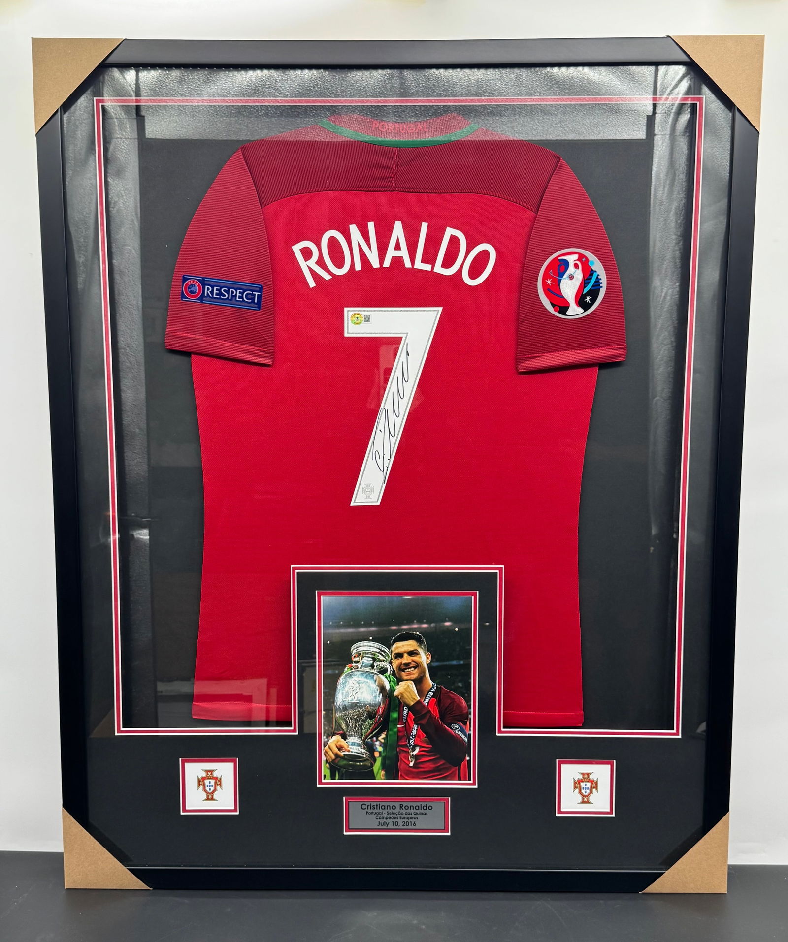 RARE Cristiano Ronaldo Signed Portugal Jersey Framed: Framed Cristiano Ronaldo signed Portugal national team jersey. Features a photo of Ronaldo with the Euro Cup. Framed and ready to hang. Dimensions: H:42in; L:34in.