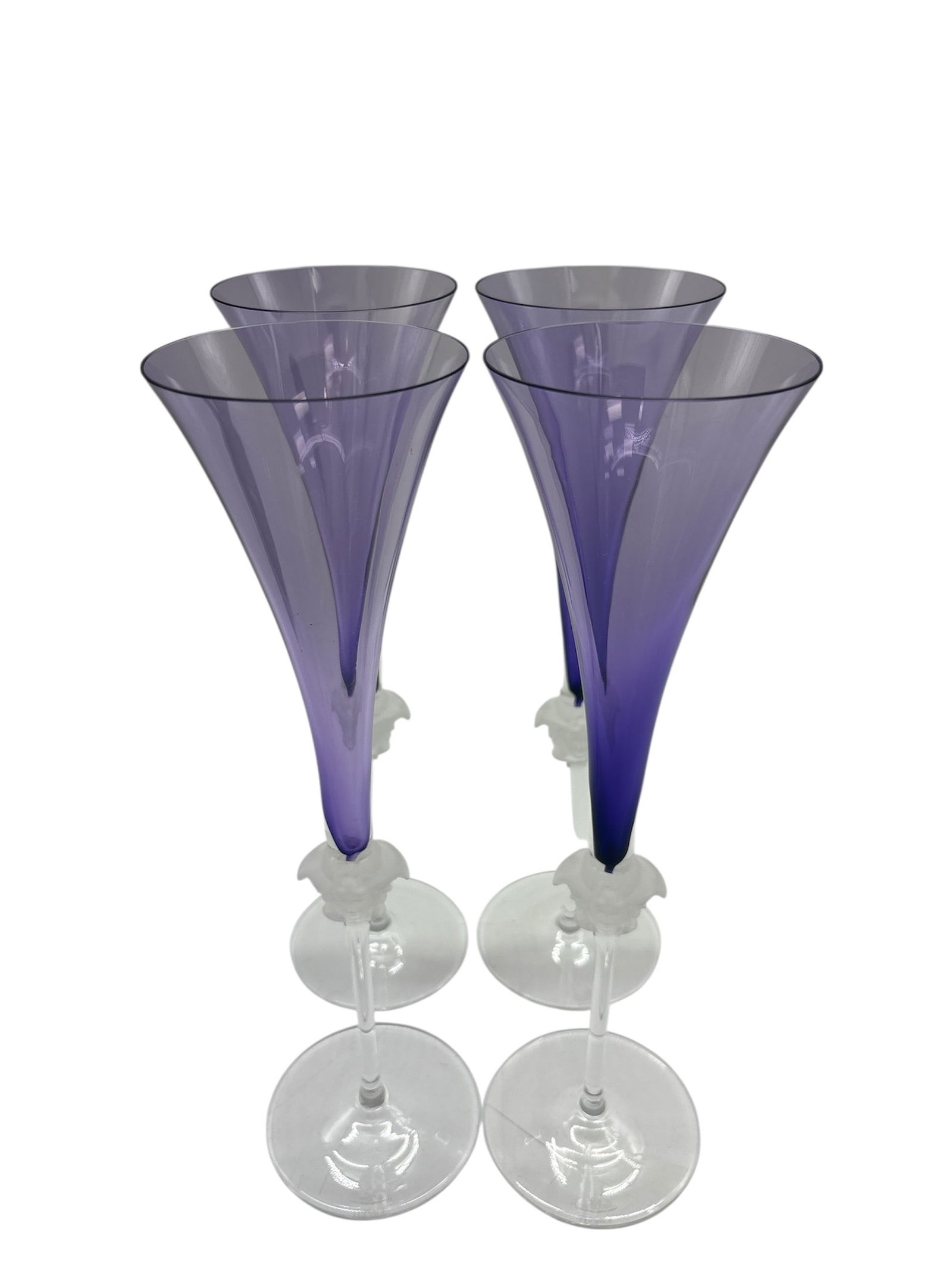 Set of 4 Versace Rosenthal Medusa Lumiere Amethyst Crystal Champagne Flutes: Description:This listing is for a stunning set of four (4) Versace Rosenthal crystal champagne flutes from the sought-after "Medusa Lumiere" collection.These flutes are