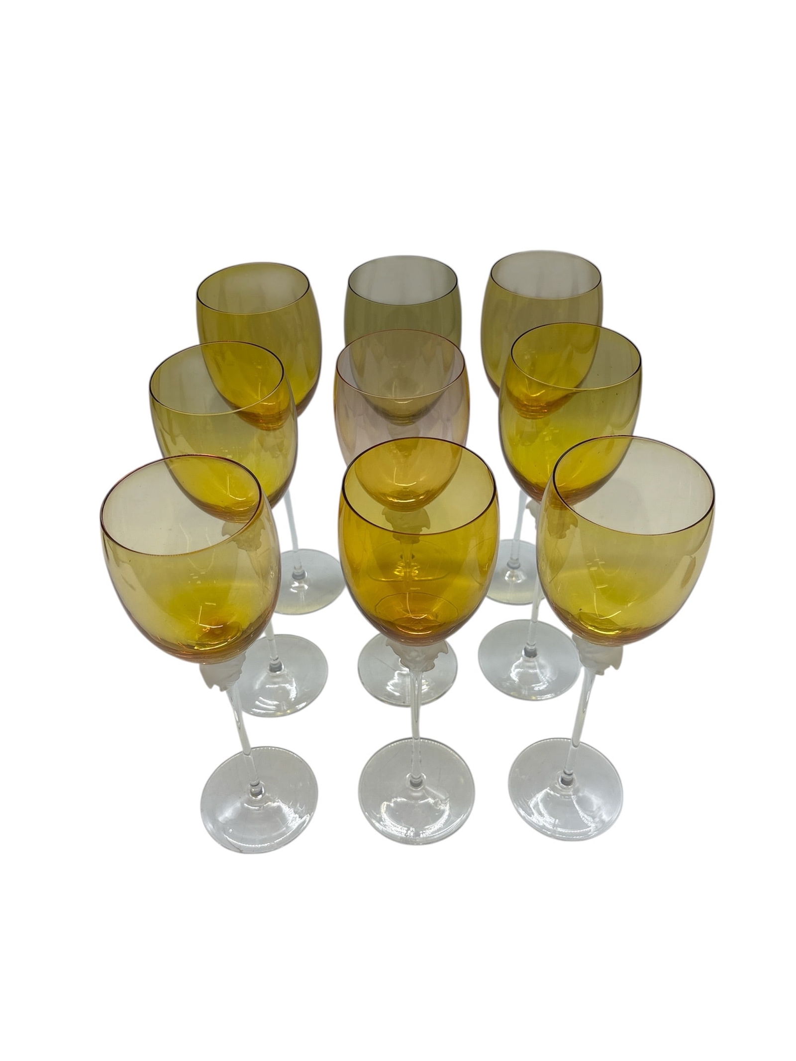 Full Set of 9 Rosenthal Versace "Medusa Lumiere" Amber Crystal Wine Glasses/Water Goblets: DescriptionOffered here is an exceptional and highly sought-after full set of twelve (12) authentic Rosenthal for Versace "Medusa Lumiere" stemware, featuring the