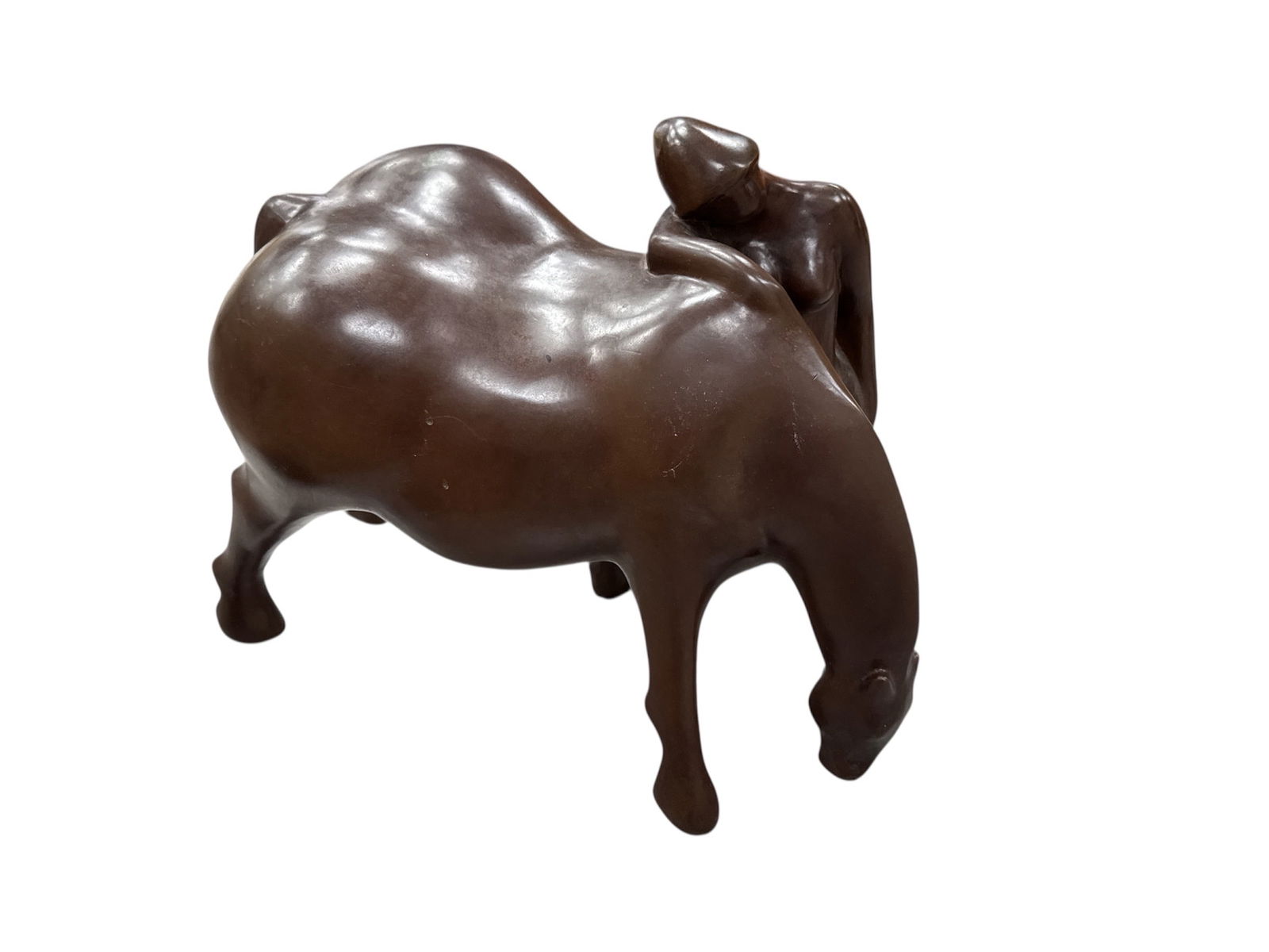 Julio Maragall, Spanish (Spain, b.1936) Bronze: This modern bronze sculpture depicts a powerful animal form, interpreted as either a horse or bull, with a stylized female figure positioned atop or emerging from the animal’s back. The composit