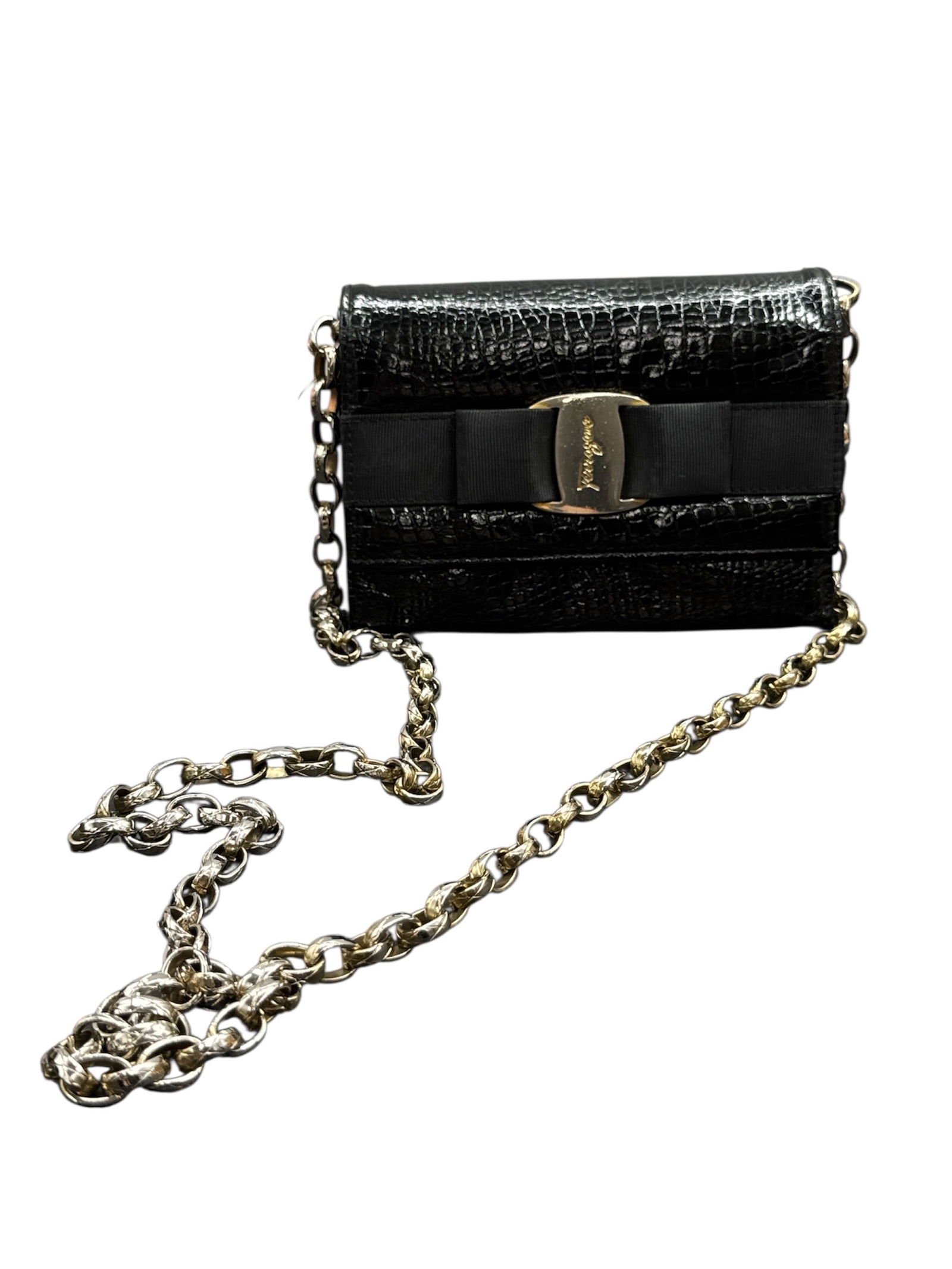 Salvatore Ferragamo Black Embossed Leather Chain Shoulder Bag: This Salvatore Ferragamo shoulder bag is crafted from black embossed leather with a crocodile-style texture, presenting a compact and elegant silhouette. The design features a fold-over flap accented