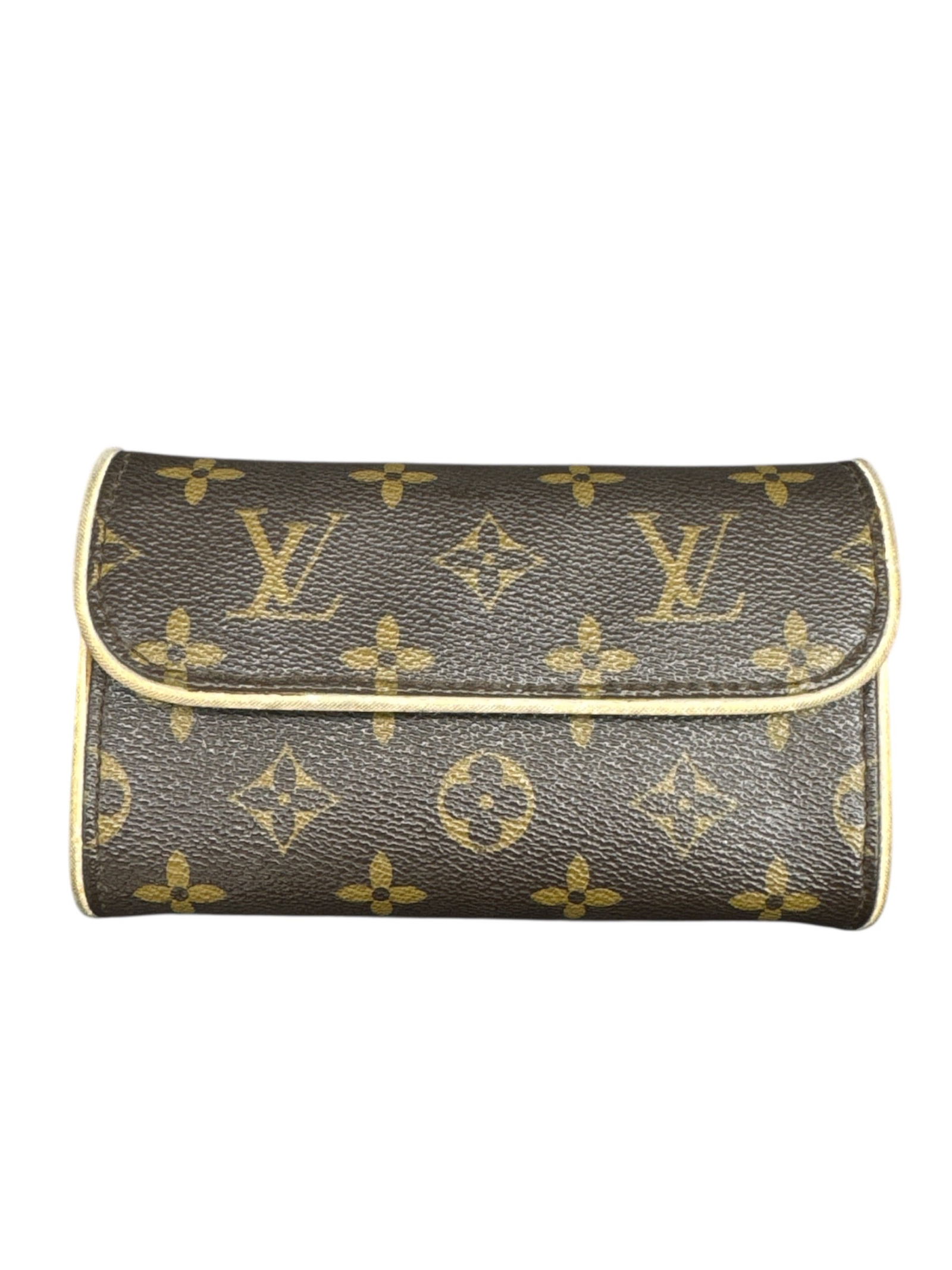 Louis Vuitton Monogram Canvas Cosmetic Pouch, Made in France: This Louis Vuitton cosmetic pouch is crafted from the brand’s iconic monogram-coated canvas with a softly structured silhouette and a fold-over flap design. The compact form is ideal for