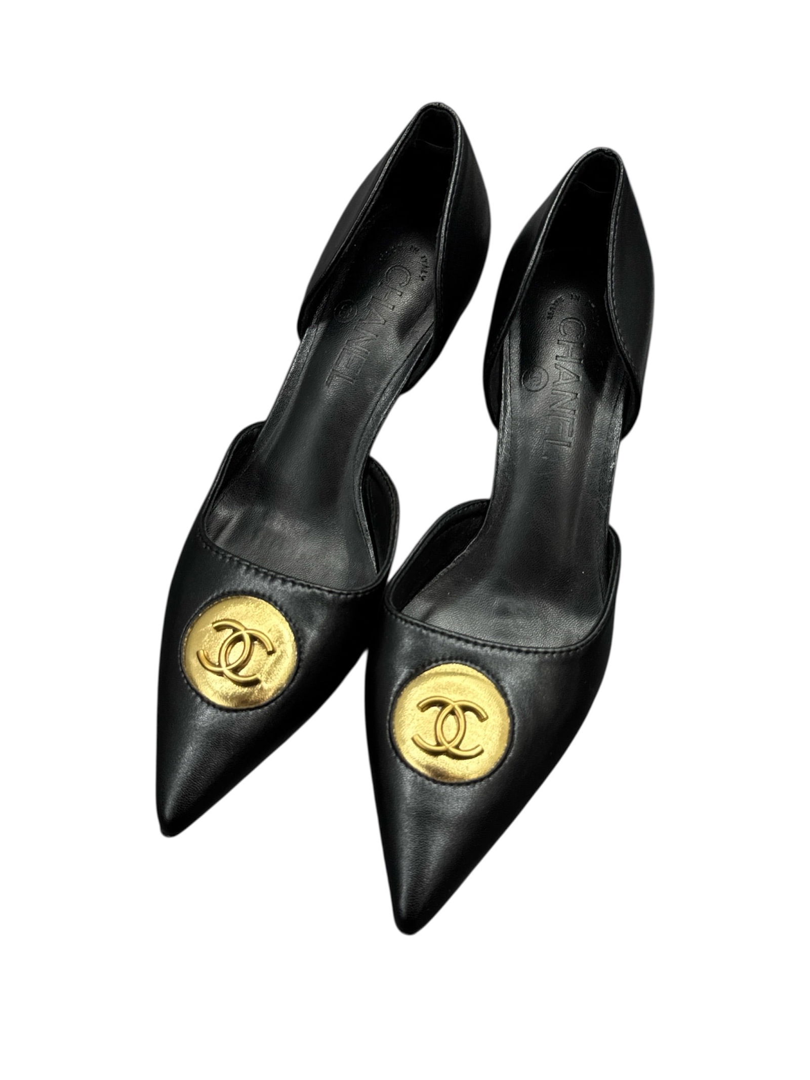 Chanel Black Leather Pumps with Gold CC Logo, Size 39: These Chanel pumps are crafted from black leather and feature a pointed toe silhouette accented with the iconic gold-tone interlocking CC logo at the vamp. The design reflects Chanel’s timeless