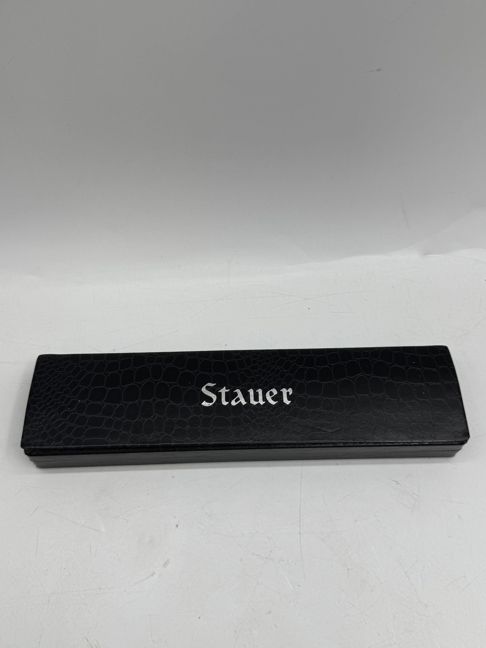 Stauer Wristwatch with Box: Stauer wristwatch with a black leather band and silver-tone face. Includes original box and paperwork.