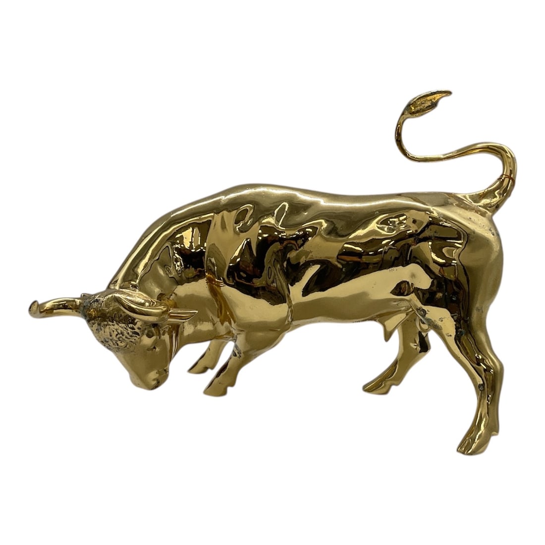 Large Gold Tone "Charging Bull" Attributed to Arturo Di Modica:  "Charging Bull" Replica "Miniature"The original sculpture was installed without permission in front of the New York Stock Exchange in 1989 as a symbol of strength and