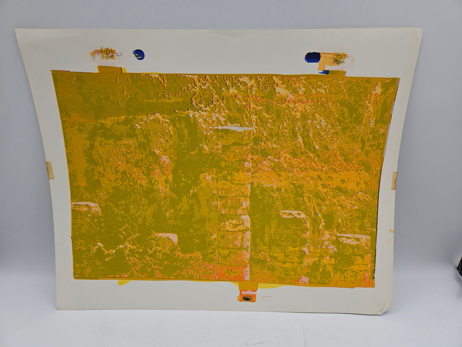 Abstract Expressionist Print: Abstract expressionist print featuring textured yellow and orange hues. The work is unsigned and presented on paper. Dimensions: 23 inches high by 29 inches long.