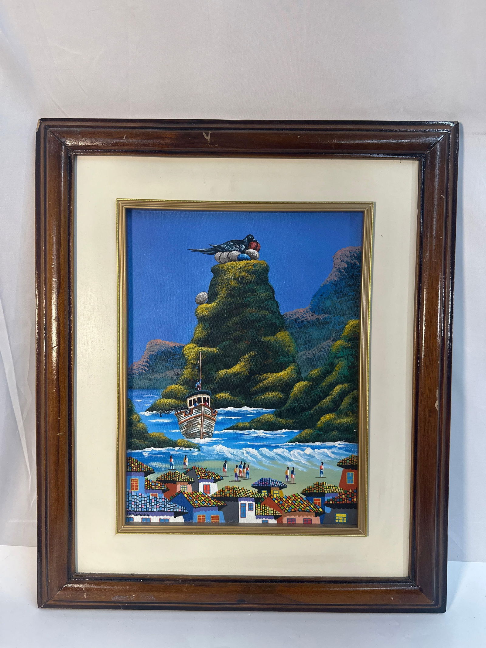 Oil on Canvas By Losama (Ecuador): This vibrant and detailed painting by Ecuadorian artist Losama showcases a picturesque coastal village set against a dramatic natural landscape. The central focus is a tall, rocky outcrop with a figur