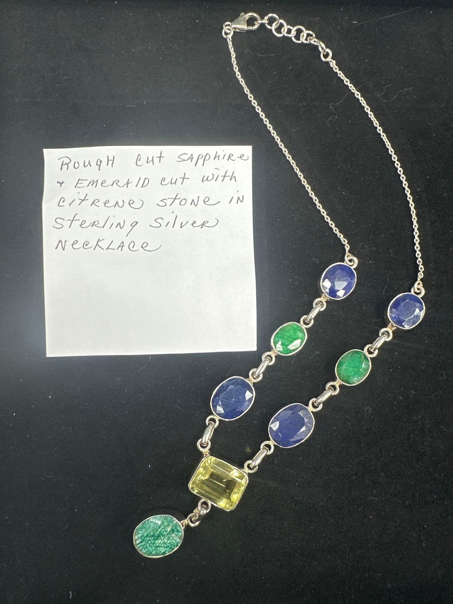 Sterling Silver Necklace with Sapphire, Emerald, and Citrine Stones: Elegant necklace featuring rough-cut sapphire and emerald stones accented by an emerald-cut citrine centerpiece. All set in sterling silver with a lobster clasp. Dimensions: Length 20in Medium: S