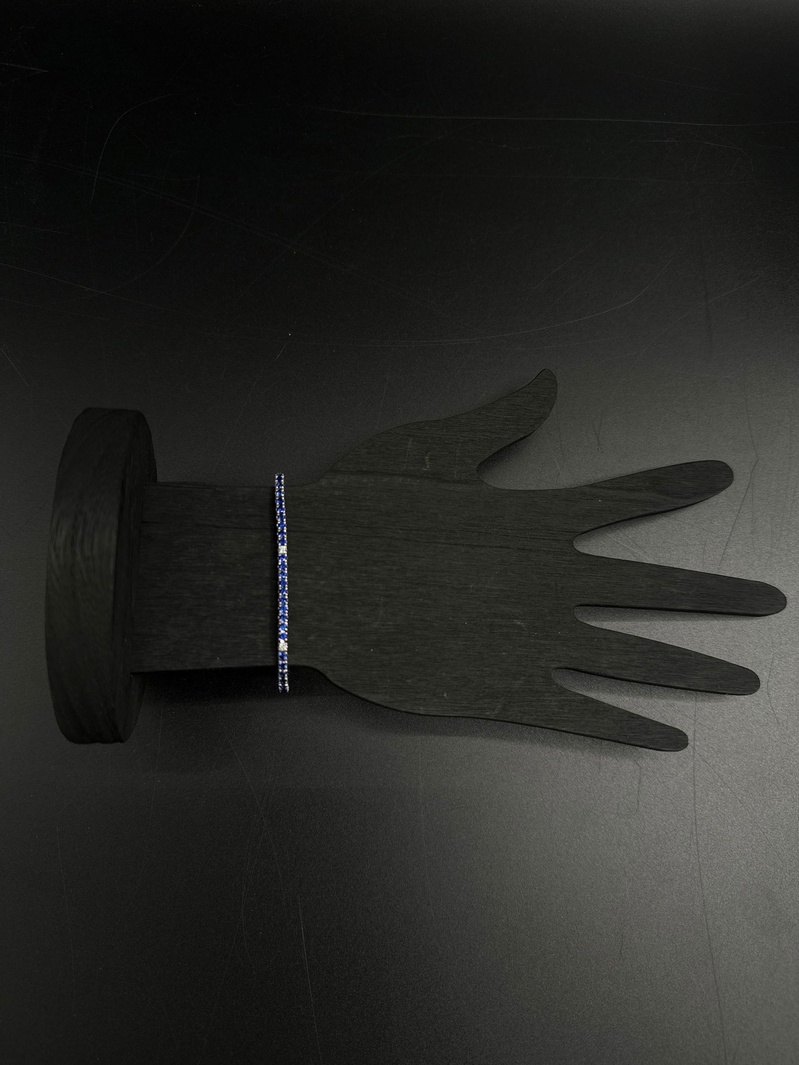 18kt Sapphire and Diamond Tennis Bracelet: Exquisite 18kt white gold tennis bracelet featuring alternating deep blue sapphire and diamond stones in prong settings. Sophisticated design, excellent condition. A timeless piece for luxury collecto