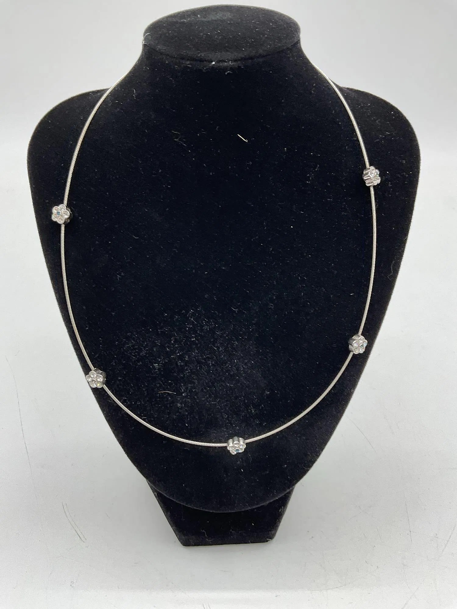 Silver-Tone Wire Necklace with Crystal Flower Accents: Delicate wire necklace featuring a central silver-tone flower charms. Lightweight and elegant, ideal for minimalist or contemporary fashion. Joan Rivers Jewelry Dimensions: L16in
