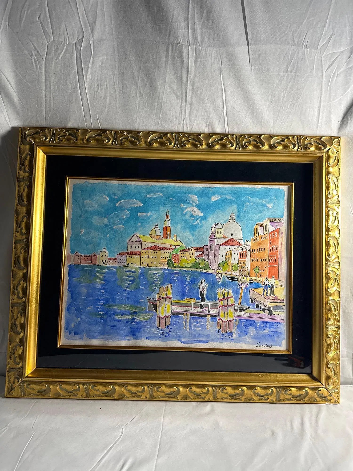 The Plaza at San Giorgio by Wayne Ensrud (American, b. 1934) Watercolor: This vibrant watercolor painting by Wayne Ensrud, titled The Plaza at San Giorgio, captures the lively atmosphere of an Italian coastal town. The scene is filled with colorful buildings, serene