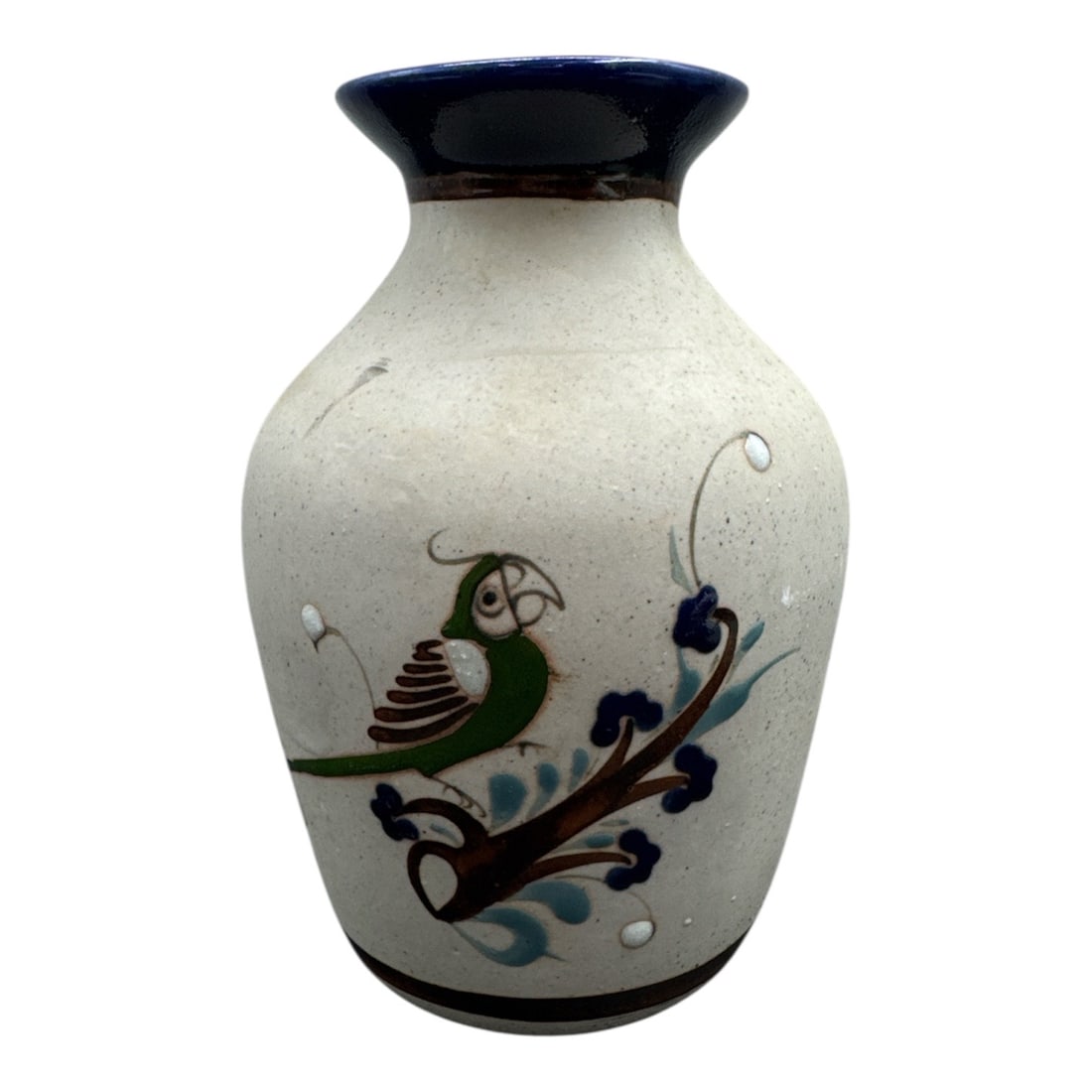 Mexican Studio Pottery Bird Motif Vase Marked Mexico Co.: Charming vintage Mexican studio pottery vase featuring a hand-decorated bird perched among scrolling floral branches. The piece displays a speckled glaze body with a deep cobalt blue rim and stylized