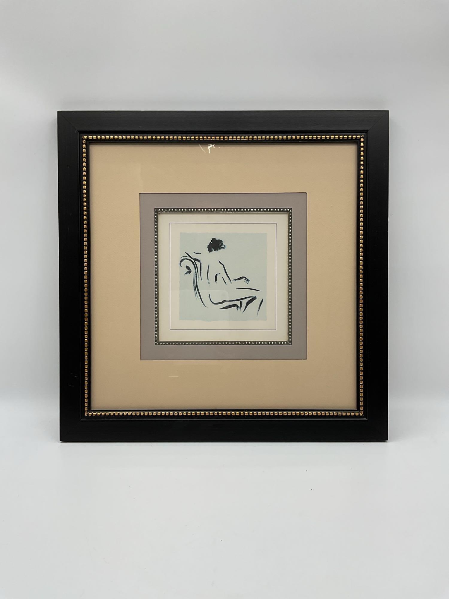 Seated Nude in Profile: Stylized minimalist portrait of a nude figure lounging in a high-backed chair, rendered with expressive black linework over a soft blue background. Framed with elegant double matting and beaded