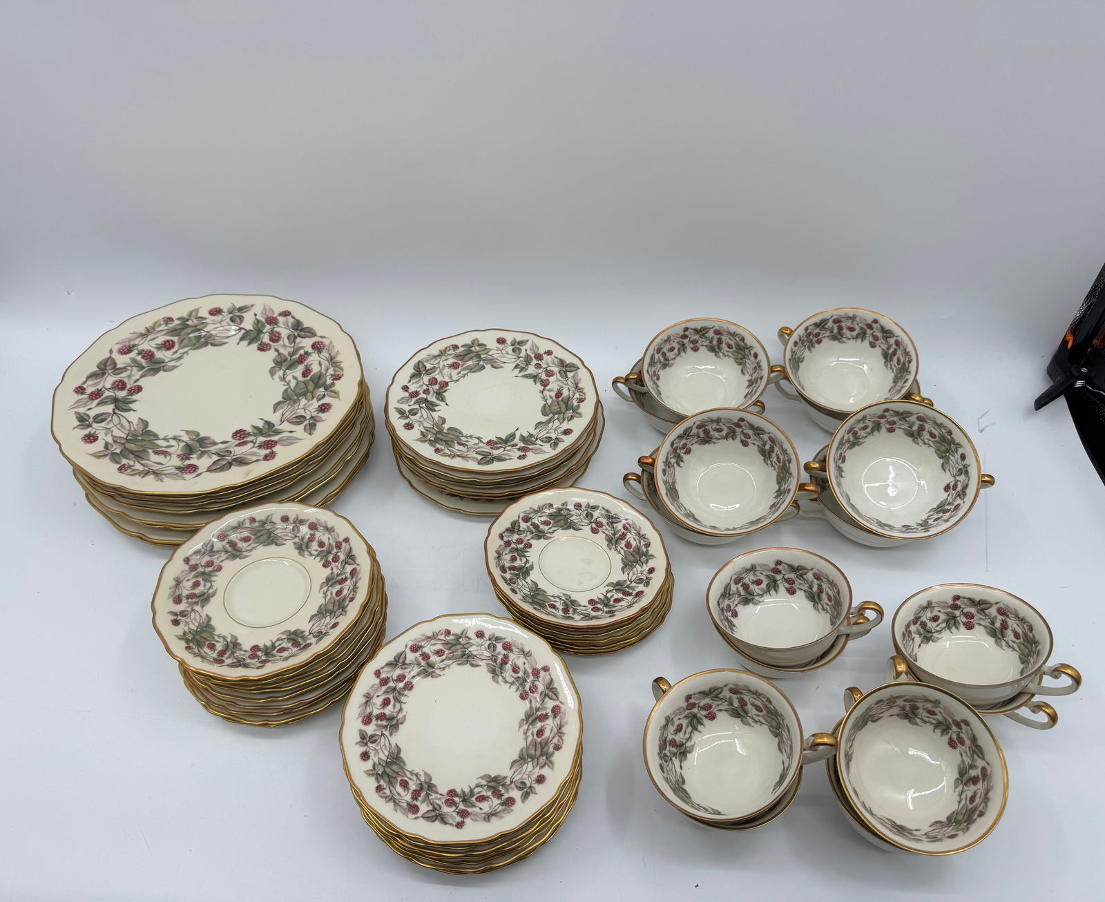 Royal York Fine China Red Raspberry Set (57 Pieces): 57-piece Royal York 'Red Raspberry' fine china set. Includes: 8 large plates, 8 medium plates, 8 small plates, 9 tea plates, 8 small tea plates, 8 cups with one handle, and 8 cups with two