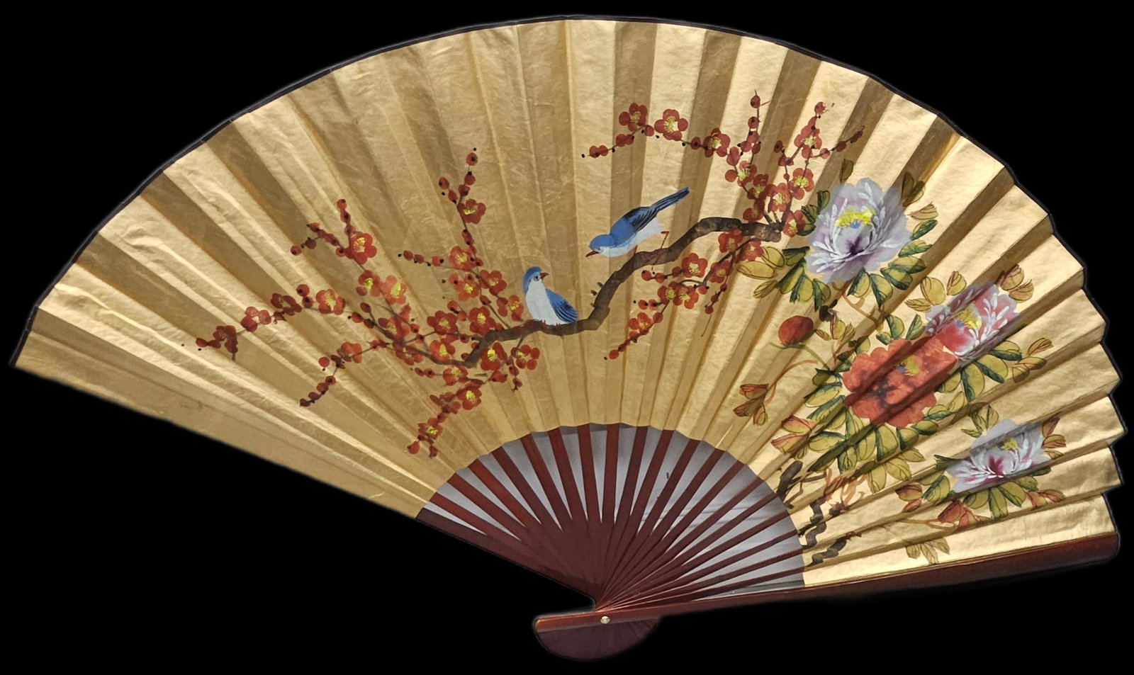 Large Hand-Painted Decorative Asian Fan with Birds and Blossoms:  Elegant decorative folding fan featuring a hand-painted design of bluebirds perched on a blossoming cherry branch alongside vibrant peonies. The gold background and lacquered wood ribs create a