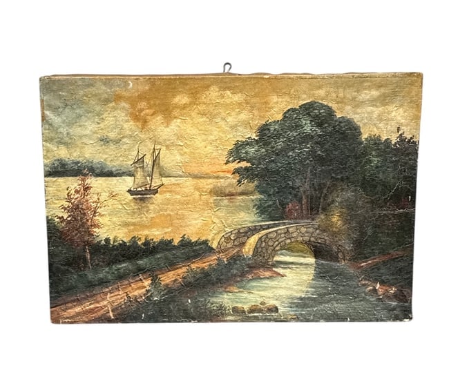 Vintage River Landscape Oil Painting with Stone Bridge and Sailing Vessel: This charming vintage oil painting depicts a serene riverside landscape featuring a gently arched stone bridge in the foreground and a sailing vessel gliding across calm waters in the distance. Warm s