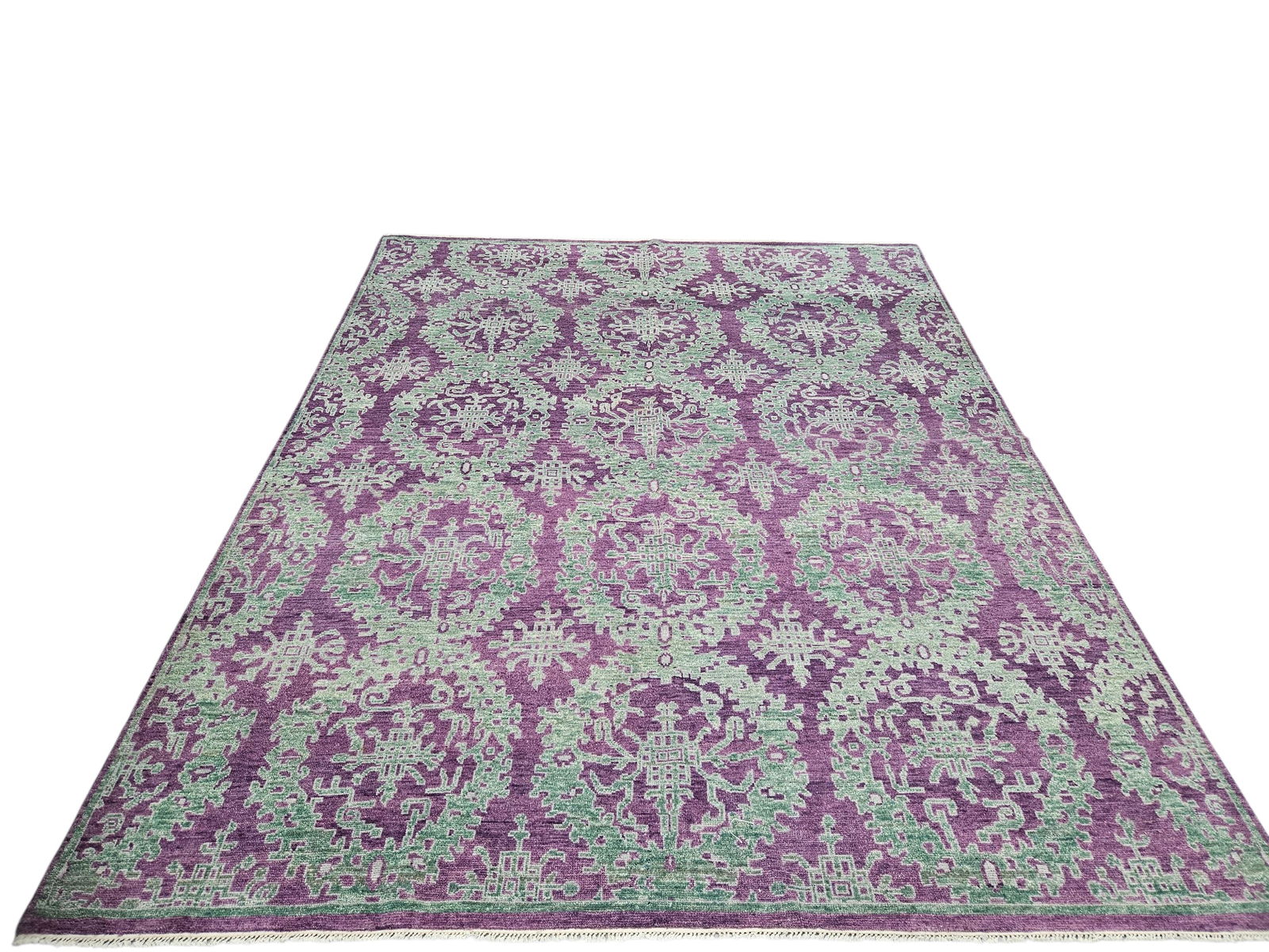 Teal on Purple Wool Rug, India: Contemporary 8x10 area rug with repeating teal medallion and scrollwork pattern on a rich purple ground, from the Sadri Collection, made in India.