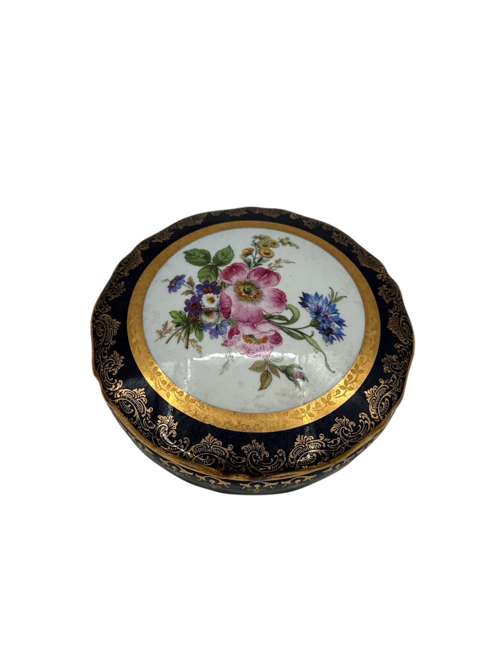 Antique Limoges France Cobalt Blue Floral Porcelain Trinket Box: This exquisite French porcelain trinket box features a deep cobalt blue ground embellished with elaborate gilded scrollwork and filigree borders. The circular lid showcases a vibrant, hand-painted cen