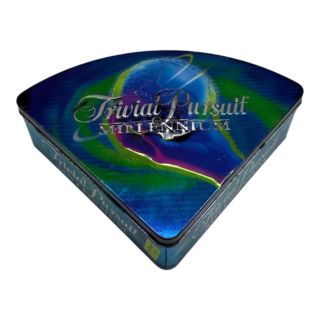 Trivial Pursuit Millennium Edition Game Set in Collectors Tin: Special Trivial Pursuit Millennium Edition game set housed in a unique triangular collector’s tin with colorful globe-inspired artwork. Includes game cards, playing pieces, and original