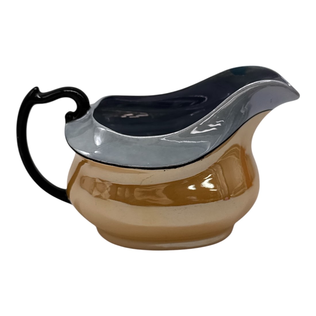 Art Deco Lusterware Creamer with Bird Mark: Charming Art Deco style lusterware creamer featuring a warm amber-toned body with a contrasting silver and black glazed rim and handle. The sleek modern silhouette reflects early 20th-century design i