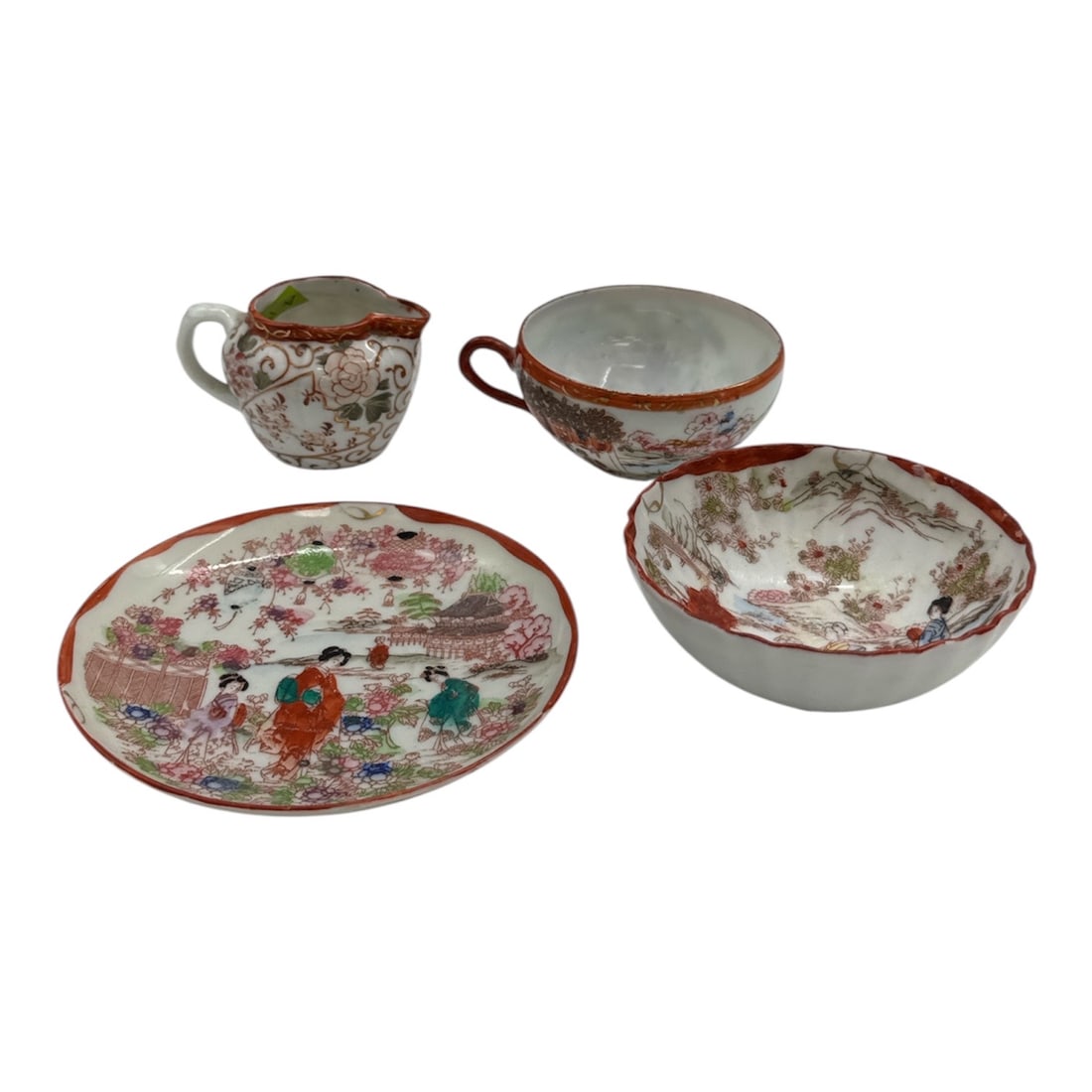 Japanese Porcelain Miniature Tea Set Group Figural & Floral Decoration: Delightful group of miniature Japanese porcelain tea service pieces, including a small plate, bowl, cup, and creamer, each decorated with colorful figural and floral scenes in an Asian-inspired palett
