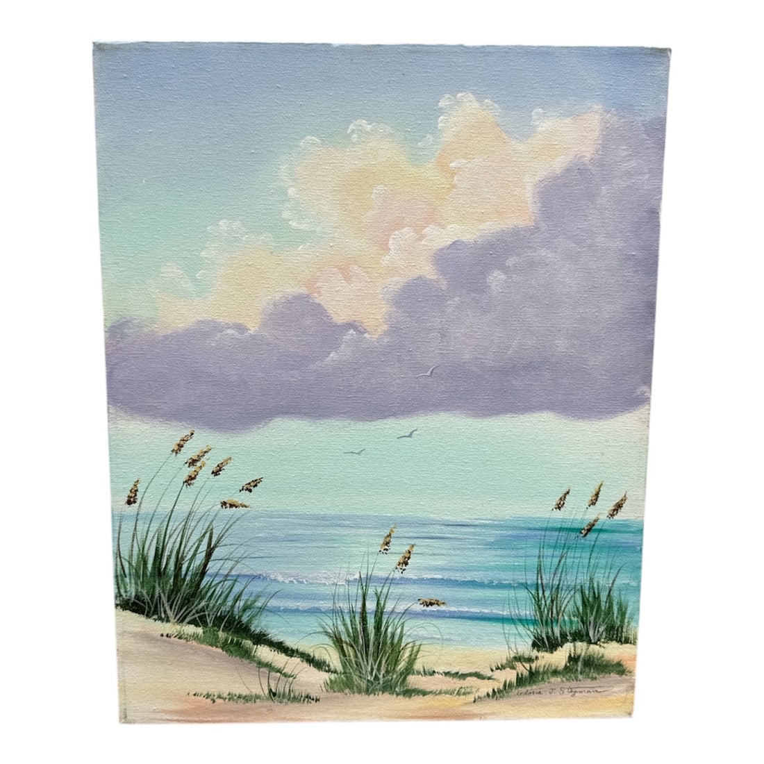 Gloria J. Stegman Signed Florida Beach Scene Painting: Original coastal painting by Gloria J. Stegman depicting a tranquil Florida beach scene with sea oats in the foreground, calm shoreline waters, and soft cloud formations overhead. Rendered in gentle p
