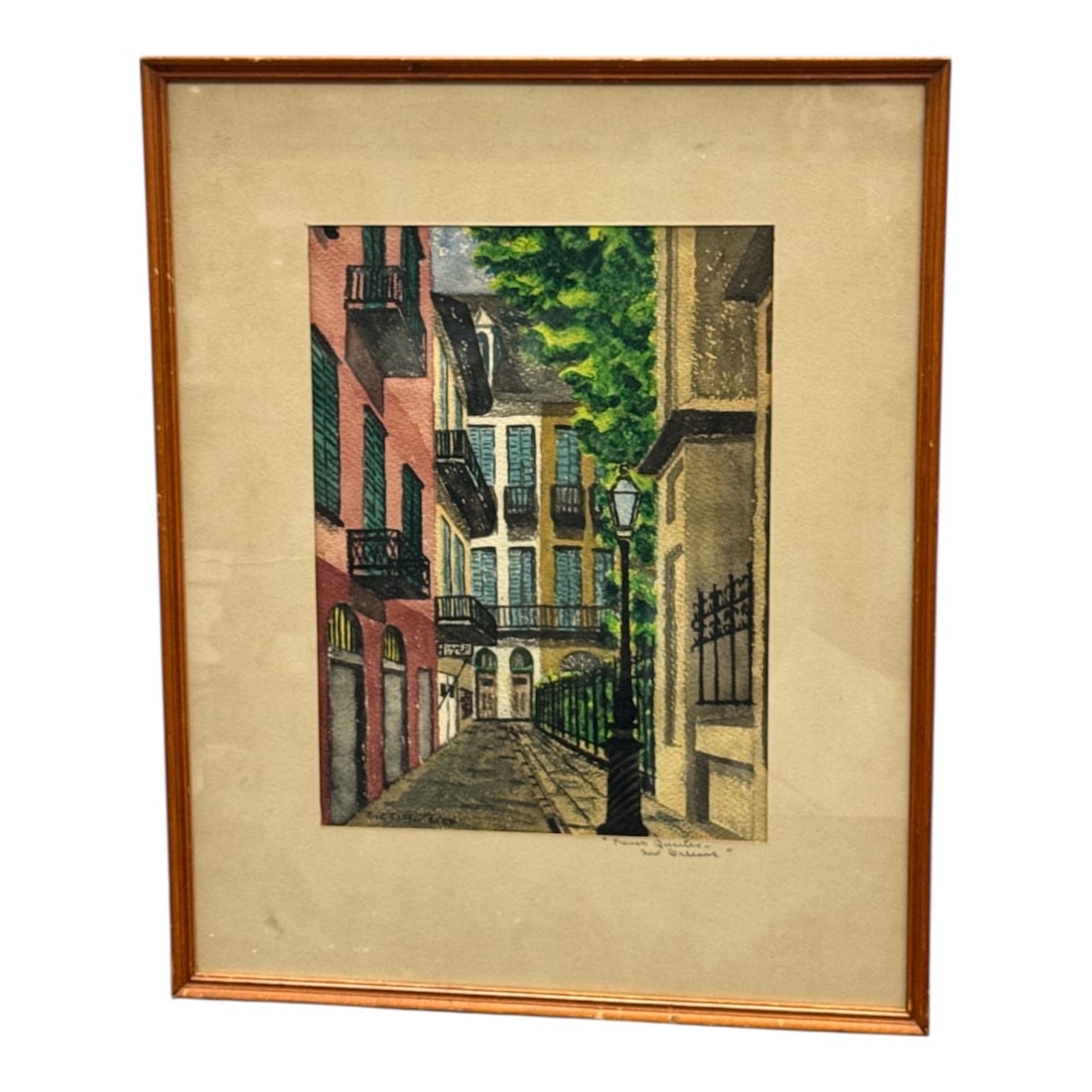 Rose Ellen Reed French Quarter New Orleans Street Scene: Watercolor painting by Rose Ellen Reed depicting a charming street scene in the French Quarter of New Orleans, featuring historic buildings with wrought iron balconies, a gas-style street lamp, and lu