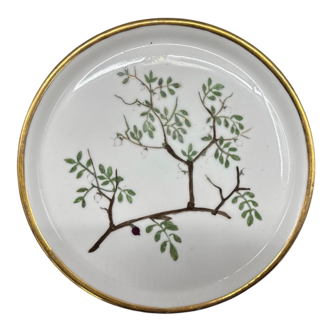 French Decorative Porcelain Plate Balsamiez de la Maque by Vergie Mouzeaux: Elegant French porcelain plate featuring a delicate hand-painted botanical branch motif with green leaves, accented by a gilt rim. The underside is inscribed “Balsamiez de la Maque” and