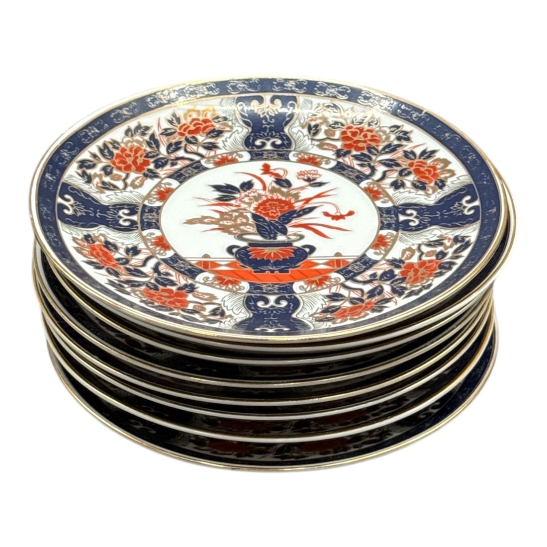 Imari-Style Porcelain Plates â€?? Made in Japan, Set of 8: Decorative set of eight porcelain plates featuring a classic Imari-style design with bold floral borders and a central bird motif in rich red, blue, and gilt tones. Marked Made in Japan with red