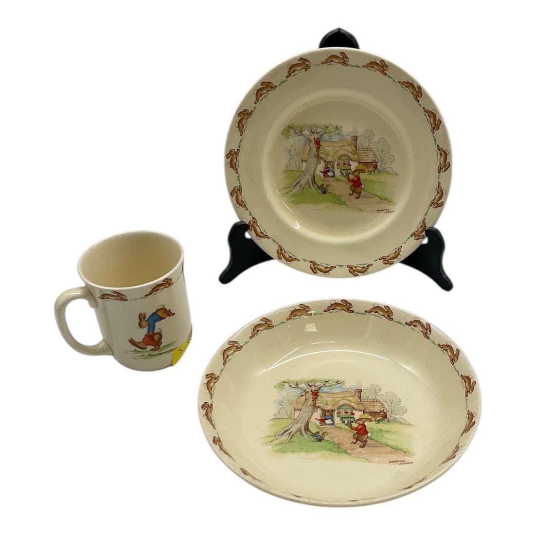 Royal Doulton Bunnykins Childrens Cup Bowl and Dish Set: This charming Royal Doulton Bunnykins childrens set includes a handled cup, shallow bowl, and matching dish, each decorated with the classic Bunnykins illustrations depicting playful rabbit scenes. De