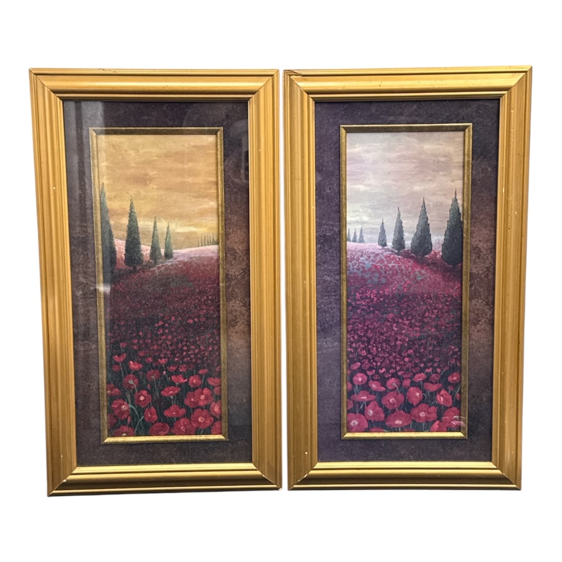 Pair of Framed Landscape Prints Tuscan Poppy Field with Cypress Trees: Beautiful matching pair of framed landscape prints depicting a vibrant poppy field stretching toward distant cypress trees under softly colored skies. Inspired by the romantic scenery of the Tuscan co