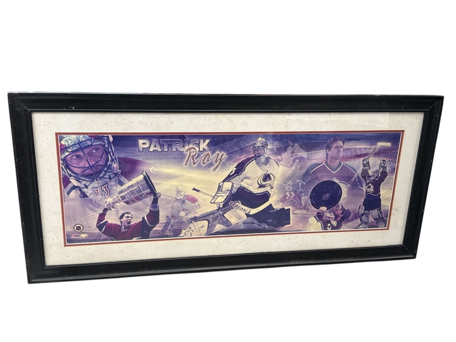 Framed Patrick Roy NHL Hockey Photo Collage Print: Large framed sports print celebrating legendary goaltender Patrick Roy, featuring a dramatic collage of action imagery including Roy in goal and iconic championship moments. Designed in bold tones wit