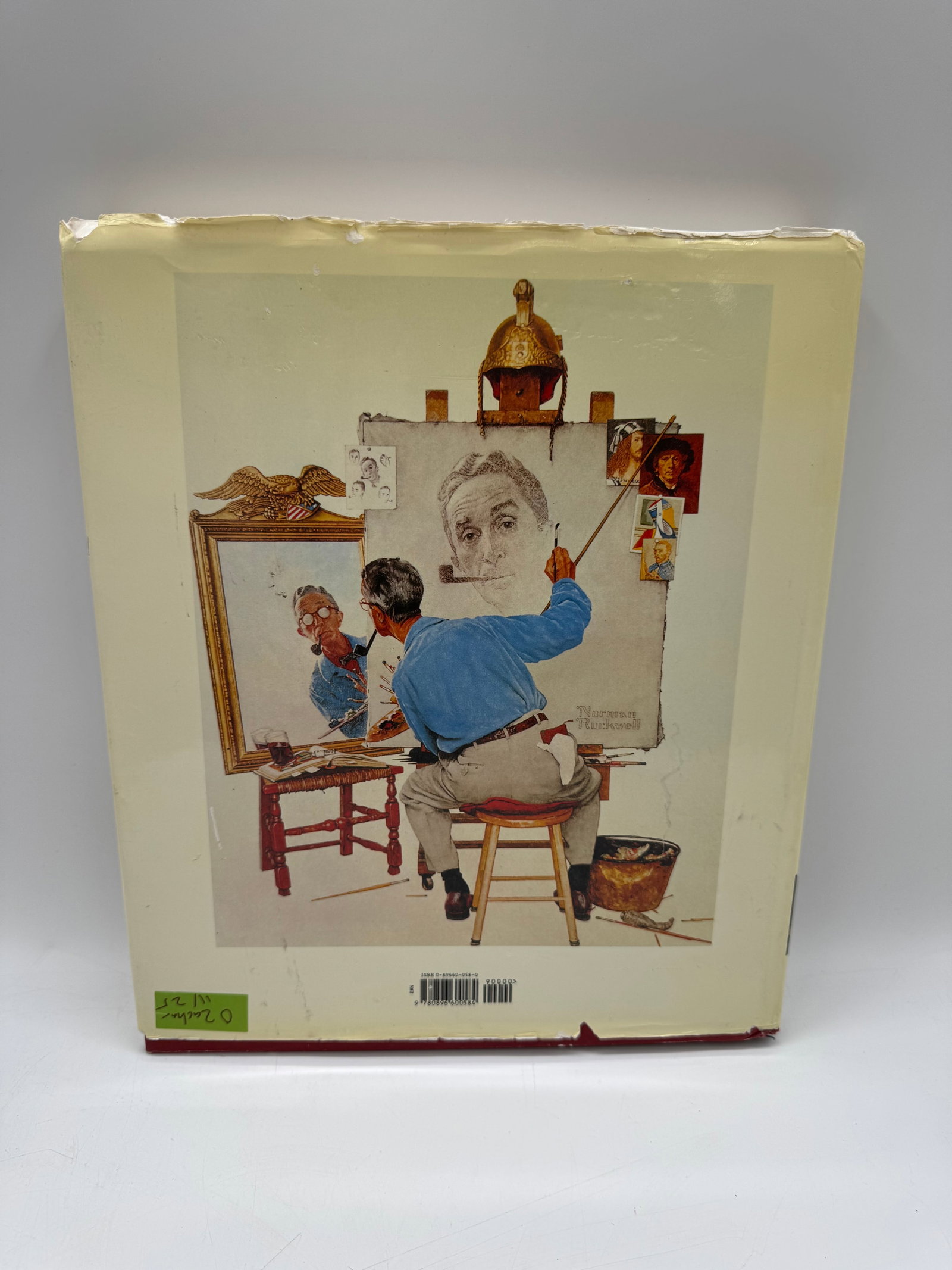 Norman Rockwell: 332 Magazine Covers Book: Hardcover book featuring 332 magazine covers by Norman Rockwell. Book shows Rockwell painting on the back cover. Dimensions approximately 14 x 12 inches.