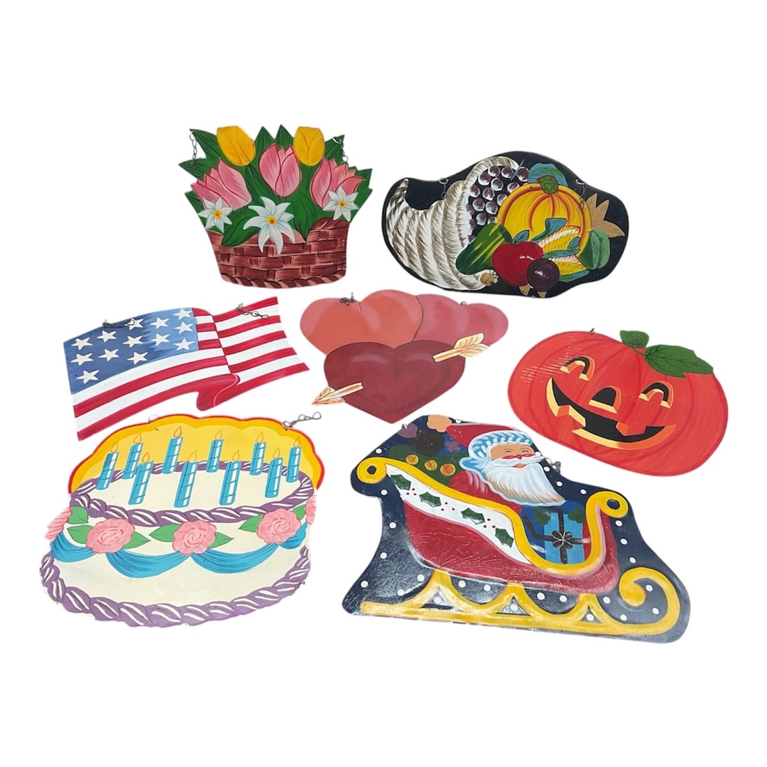 Group of Hand Painted Seasonal and Patriotic Metal Cutout Decorations: A colorful group of hand painted metal cutout decorations depicting a variety of seasonal and celebratory themes. The assortment includes a basket of flowers, cornucopia, patriotic American flag, hear