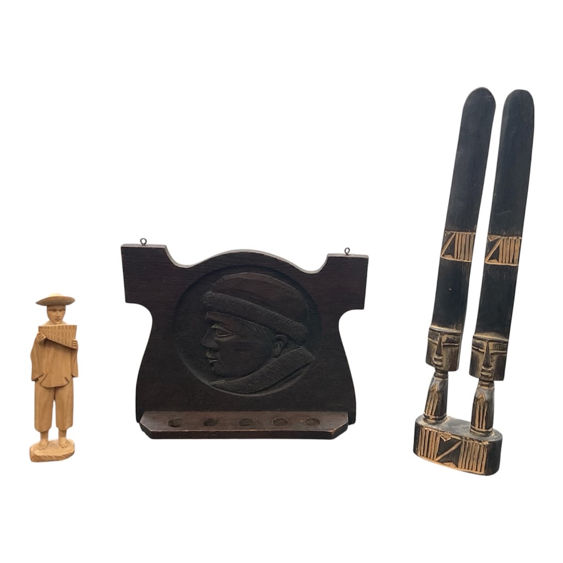 Group of Carved Wood Decorative Objects Including Ecuador Figure: A decorative group of carved wood objects including a South American figure from Ecuador, an African style carved wall plaque, and a pair of carved wood utensils. The Ecuador figure is hand carved wit
