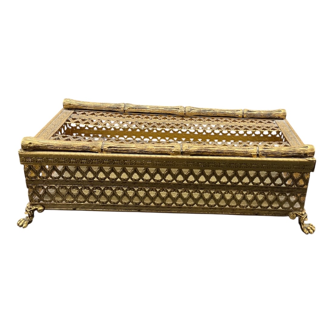 Gilt Metal Filigree Tissue Box Cover: Decorative gilt metal tissue box cover featuring intricate openwork filigree and lattice design throughout. The rectangular form is raised on ornate scrolled feet and showcases a repeating geometric p