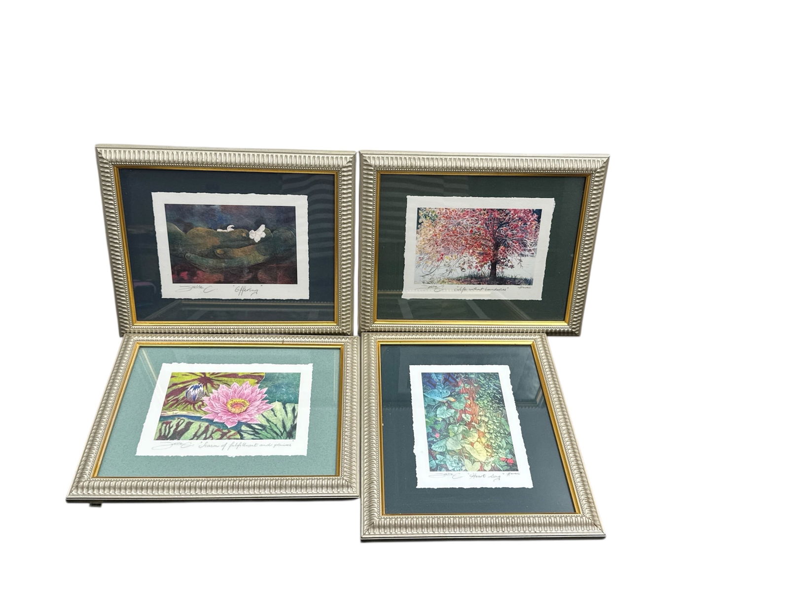 Suite of Four Signed Limited Edition Art Prints by Joelle C: This offering includes a coordinated suite of four signed limited edition art prints by artist Joelle C, each professionally framed and presented with accompanying informational cards about the