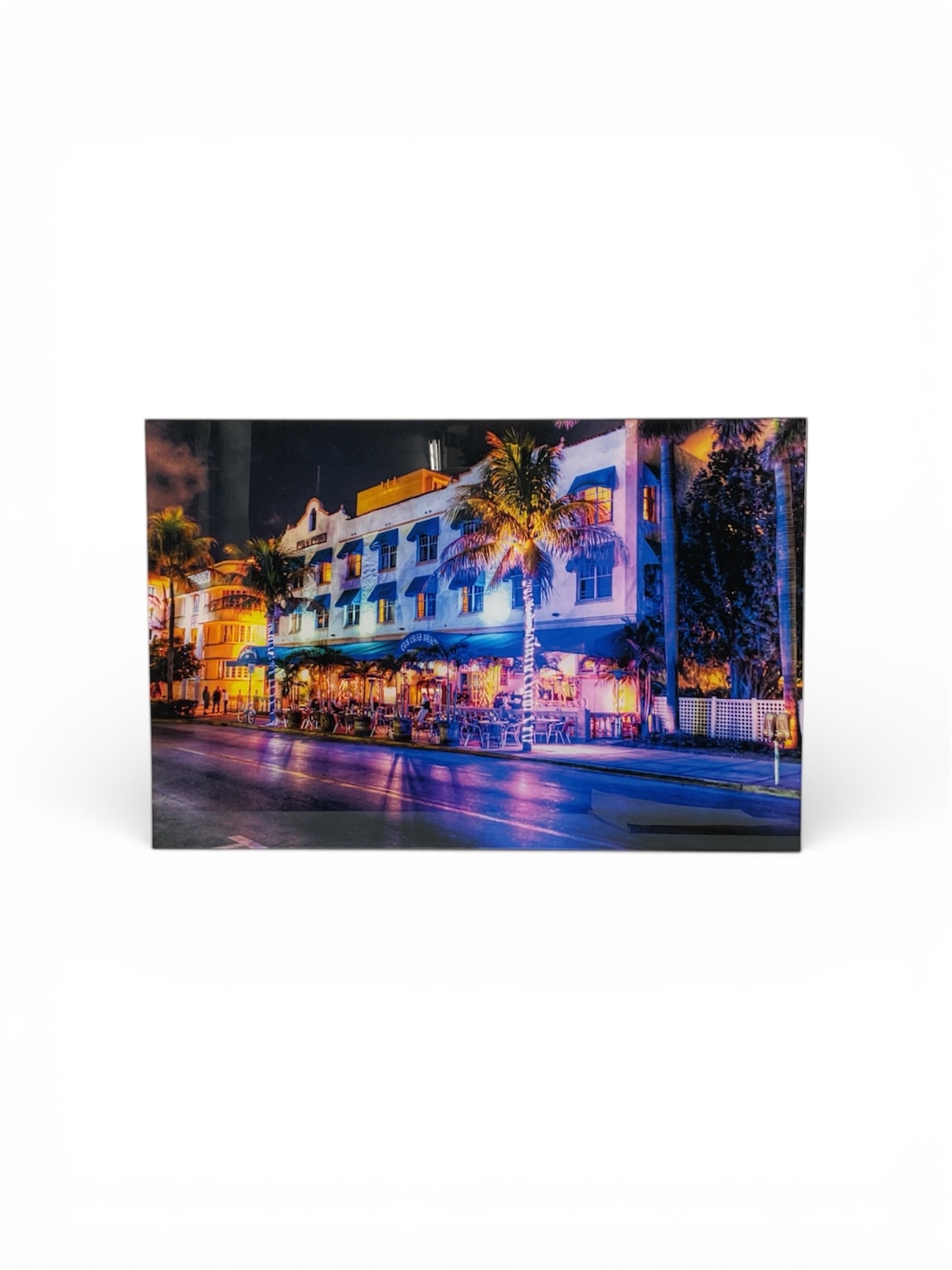 Sam Dobrow Miami Beach Ocean Drive Night Scene Giclée Print: Giclée print by Sam Dobrow depicting a vibrant nighttime view of Ocean Drive in Miami Beach. The composition features illuminated Art Deco architecture, palm trees, and motion-blurred traffic,