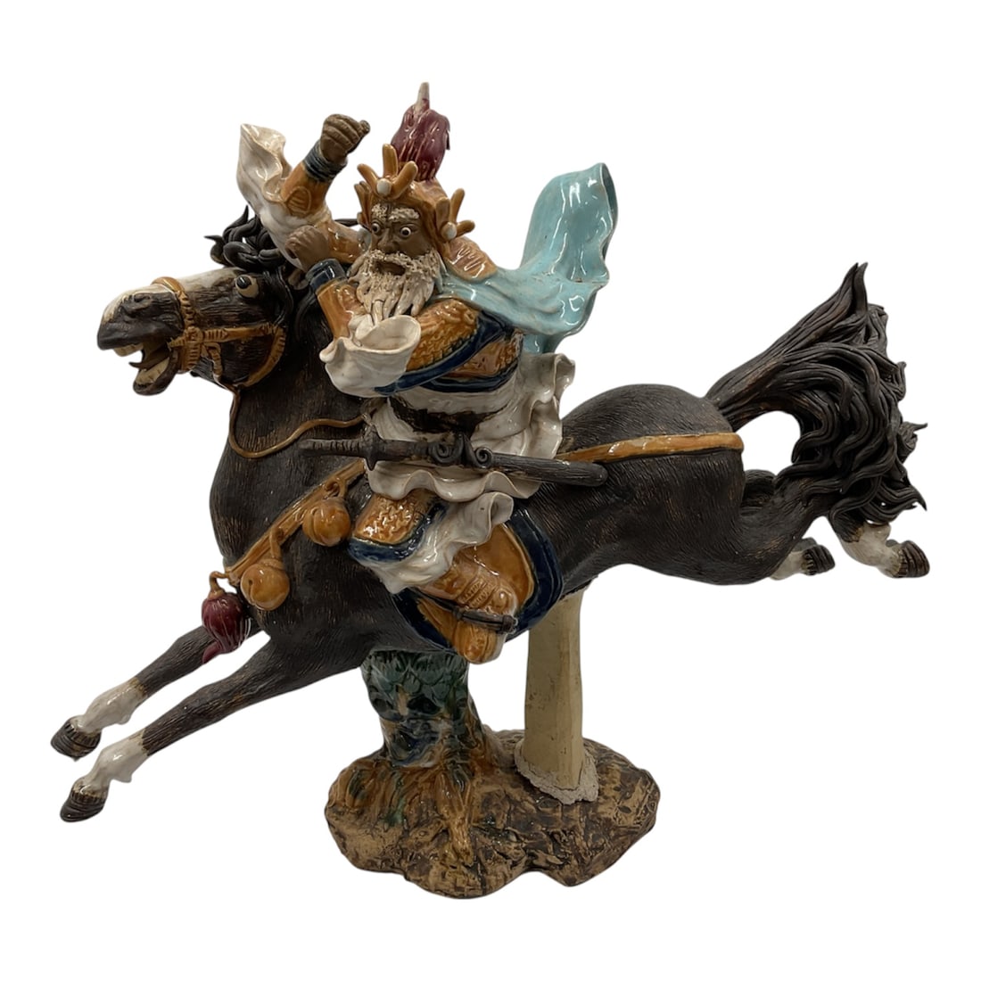 Vintage Chinese Ceramic Sculpture of Guan Gong on Horseback: A dramatic vintage Chinese ceramic sculpture depicting a warrior, likely the legendary Guan Gong, shown riding a charging horse in a dynamic pose. The figure is modeled with expressive movement, flowi