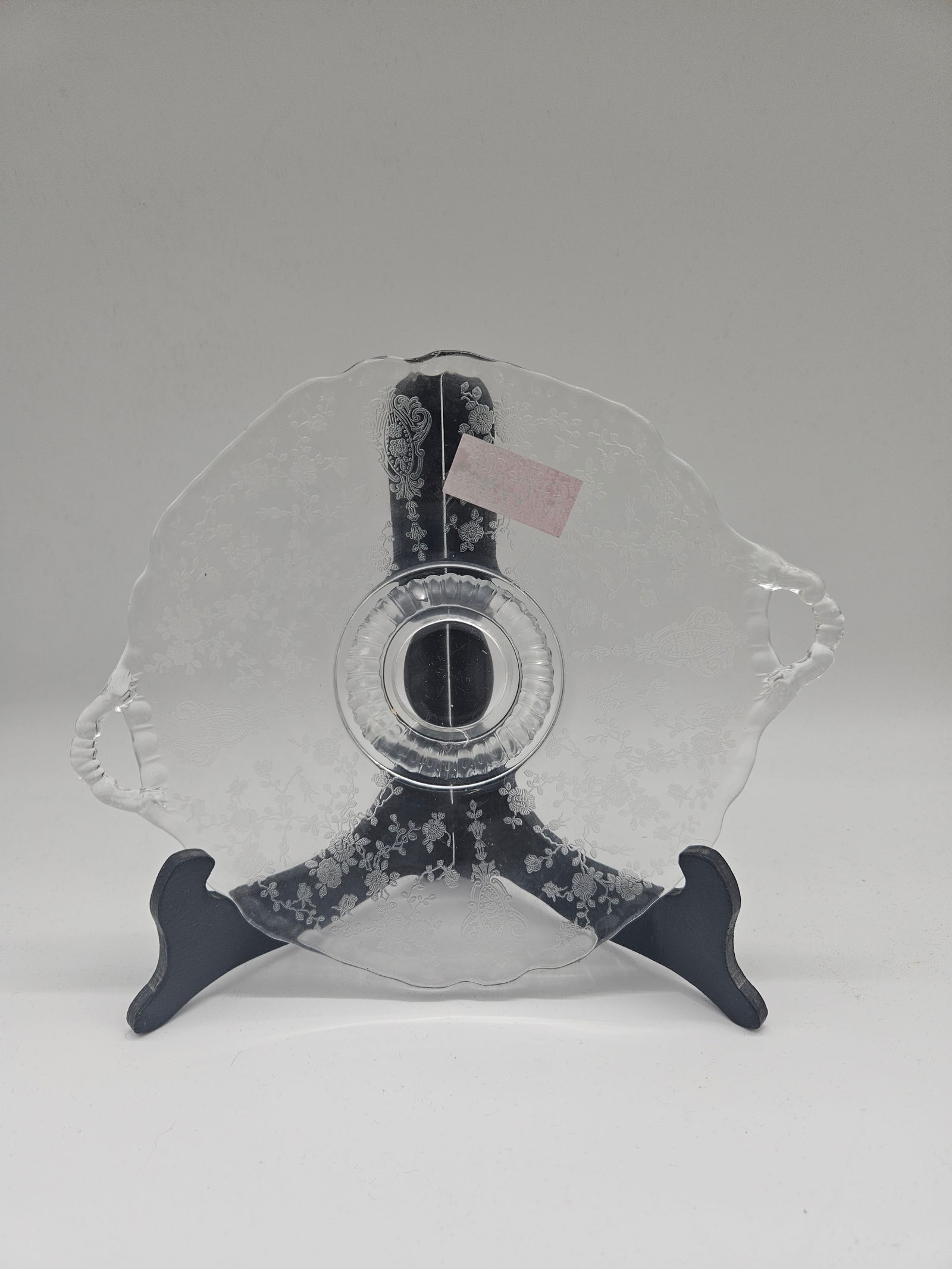 Vintage Clear Glass Footed Cake Plate, 10": Clear glass cake plate with a footed base. Approximately 10 inches in diameter. Elegant design suitable for display or serving.