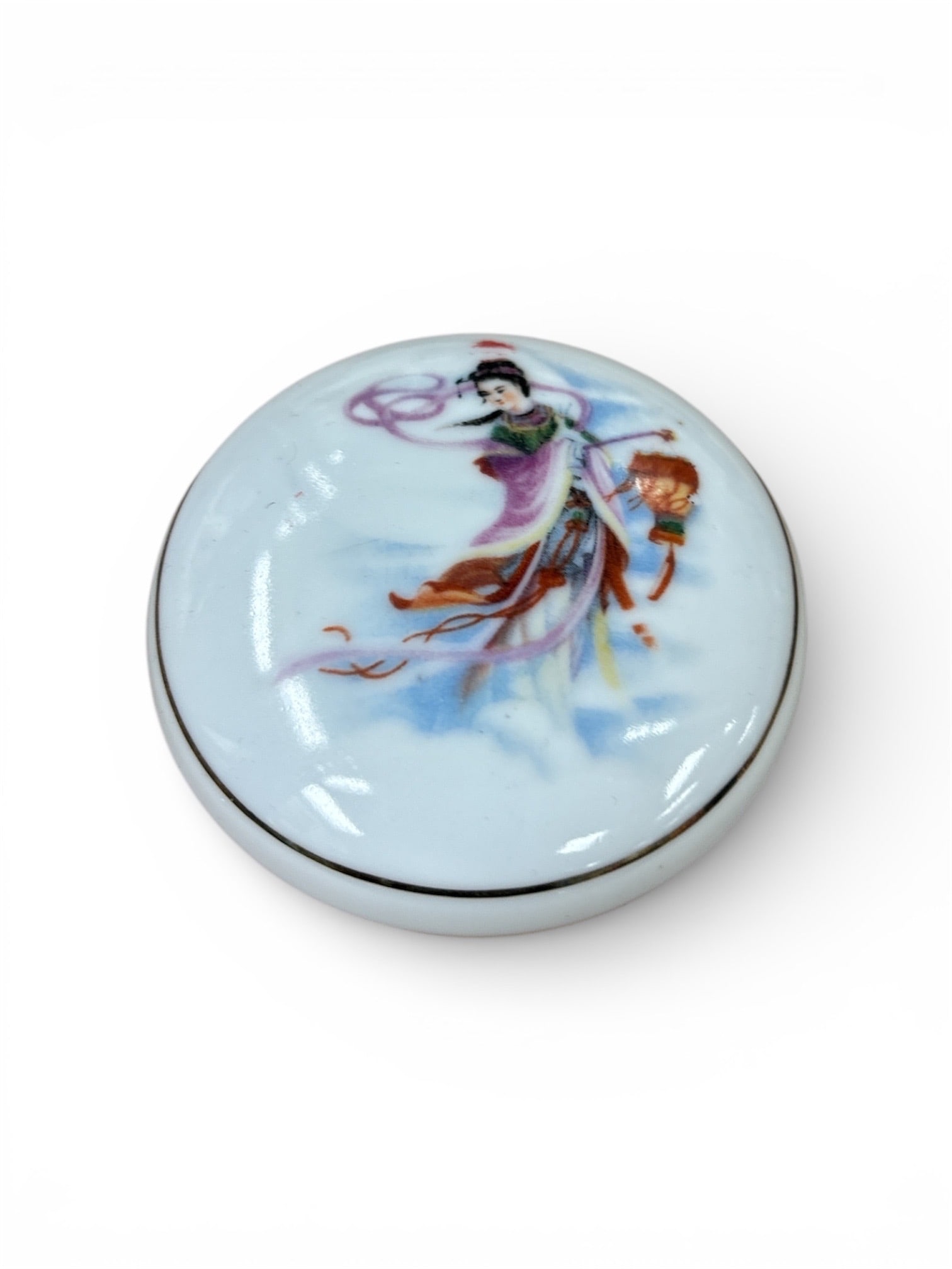 Chinese Seal Ink Paste (Yinni): This traditional Chinese seal ink paste, known as Yinni, is housed in a finely crafted porcelain lidded box decorated with a graceful figural motif in flowing robes, rendered in soft pastel tones.