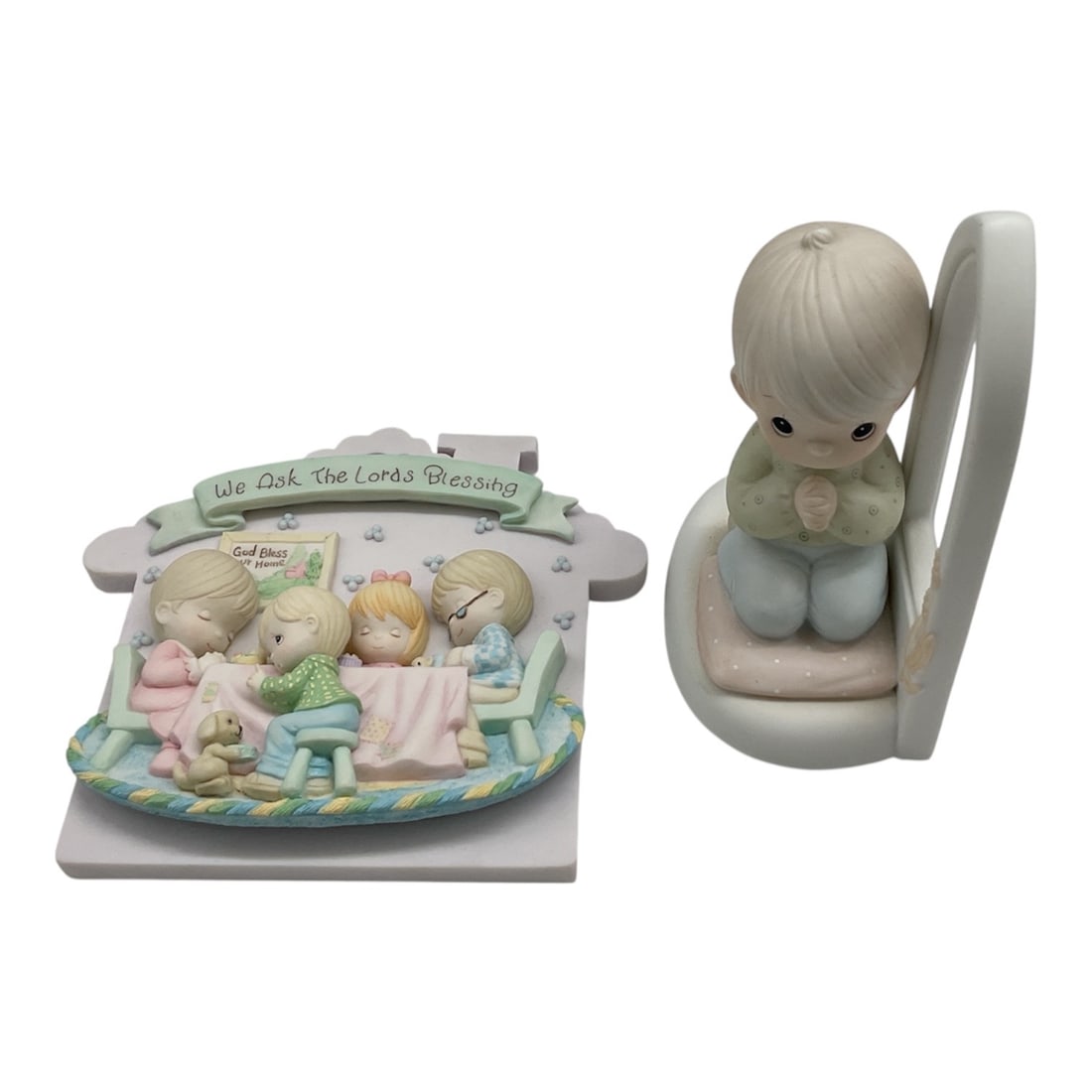 Pair of Precious Moments Collectibles: This pair of Precious Moments collectibles includes a thematic wall plaque and a matching porcelain figurine, both focusing on prayer and devotion."We Ask The Lord's Blessing"