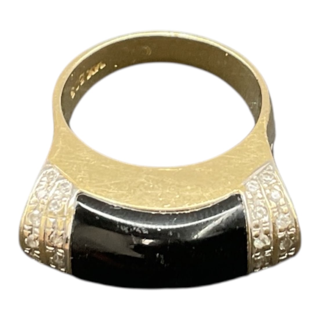 14K Yellow Gold Black Onyx Ring: Classic 14K yellow gold ring featuring a polished black onyx inlay set across the top in a smooth, curved rectangular design. The deep black onyx contrasts elegantly with the warm yellow gold,