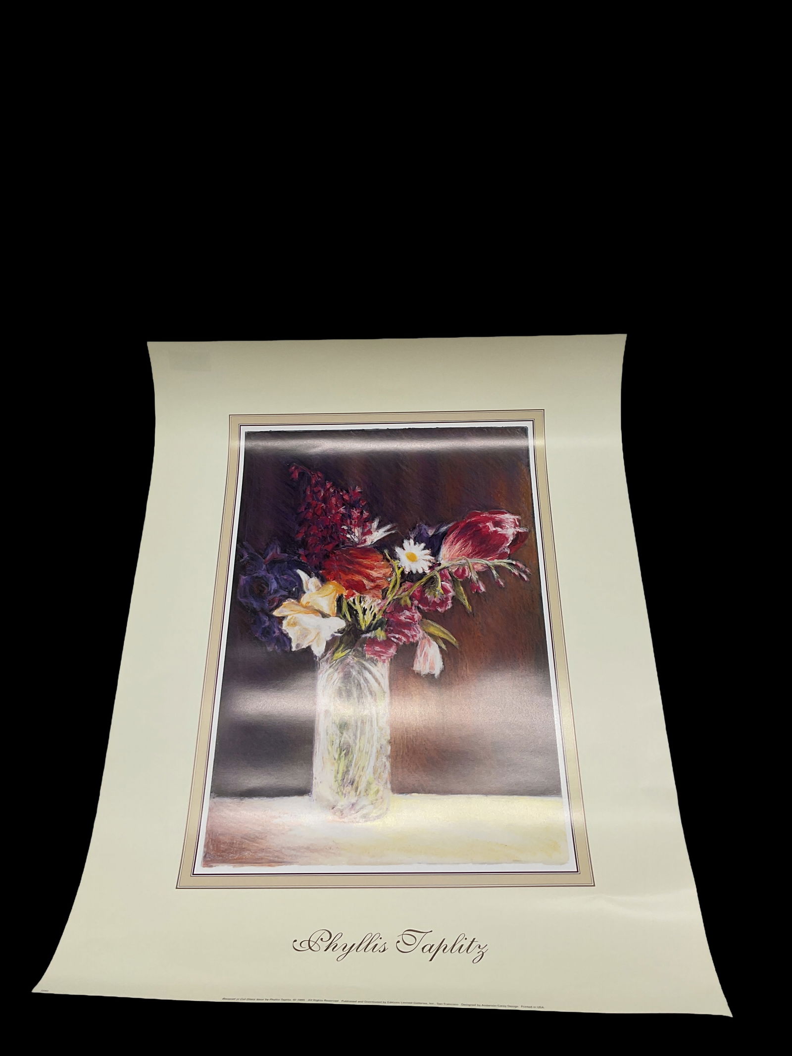 Phyllis Taplitz – Floral Still Life: Soft, expressive still life print by Phyllis Taplitz featuring a bouquet of flowers arranged in a clear glass vase against a warm, atmospheric background.Medium: Offset lithograph print on
